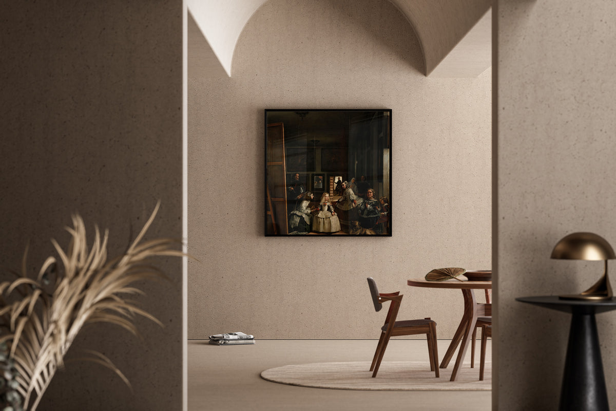Framed art print of Las Meninas by Diego Velázquez, in a sunlit dining corner