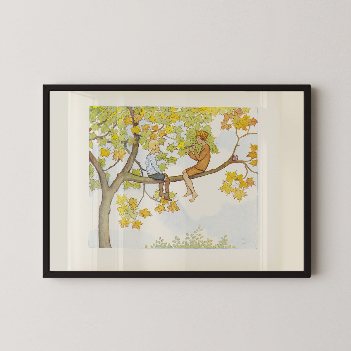 Framed art print of Lasse and September in the Maple Tree by Elsa Beskow, in a black frame on a pale wall