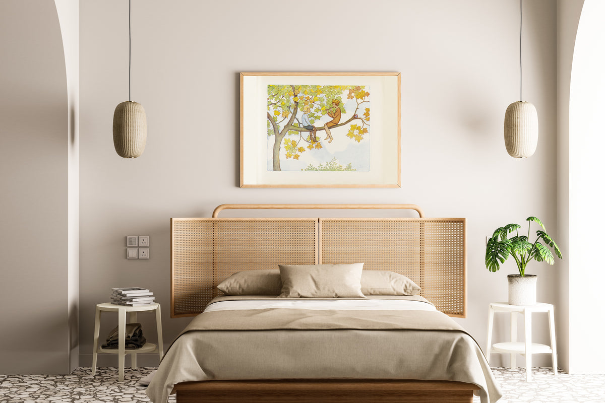 Framed art print of Lasse and September in the Maple Tree by Elsa Beskow, above a cane-headboard bed