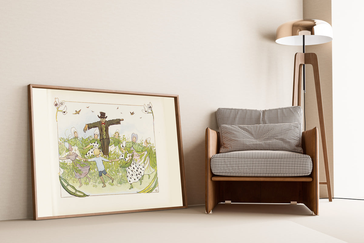 Framed art print of Lasse in the Ring Dance round the Scarecrow by Elsa Beskow, leaning against a wall beside an armchair and a floor lamp