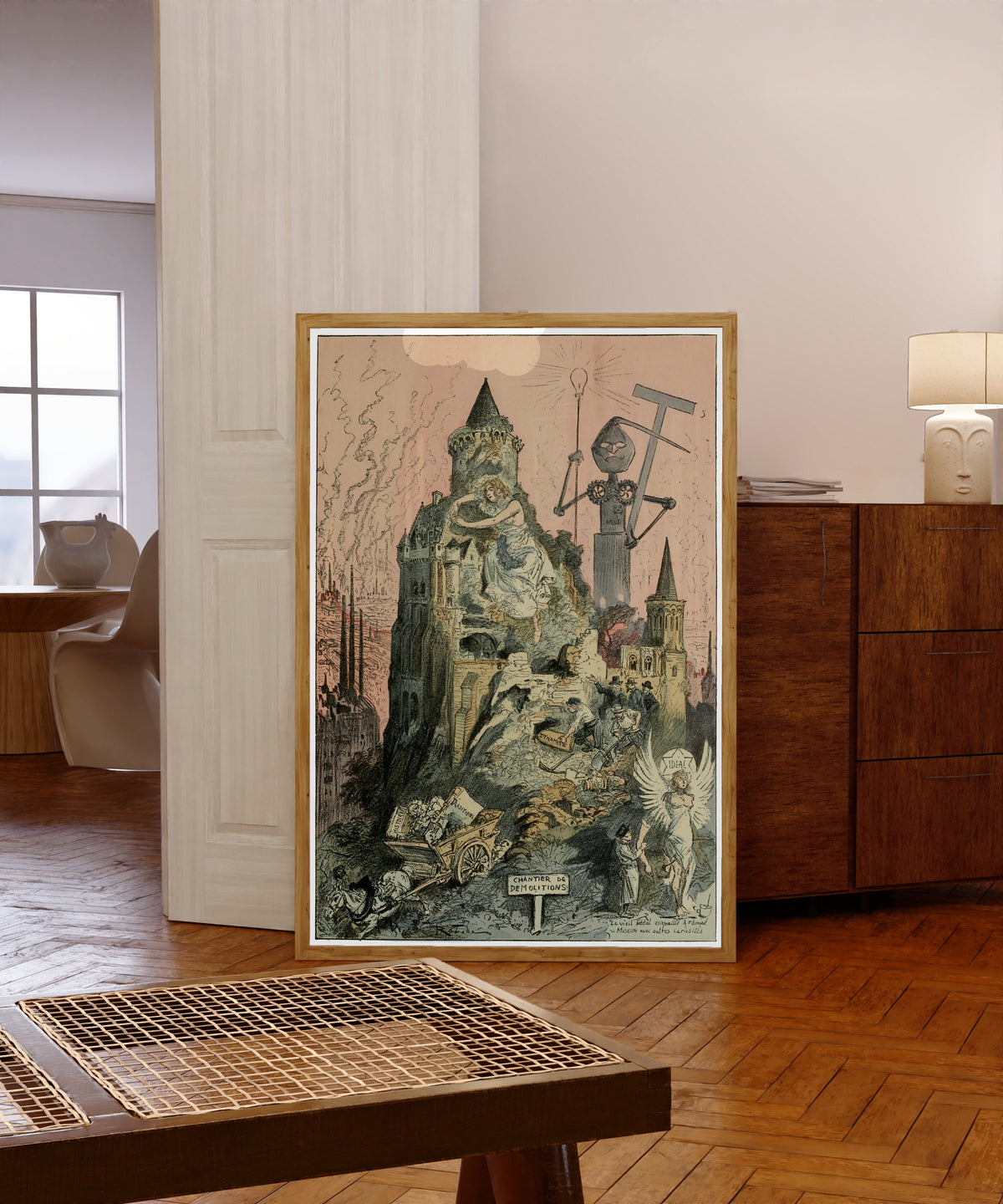 Framed art print of Le déblaiement de l'ancien monde by Albert Robida, in a light wood frame leaning in a warm room with a parquet floor