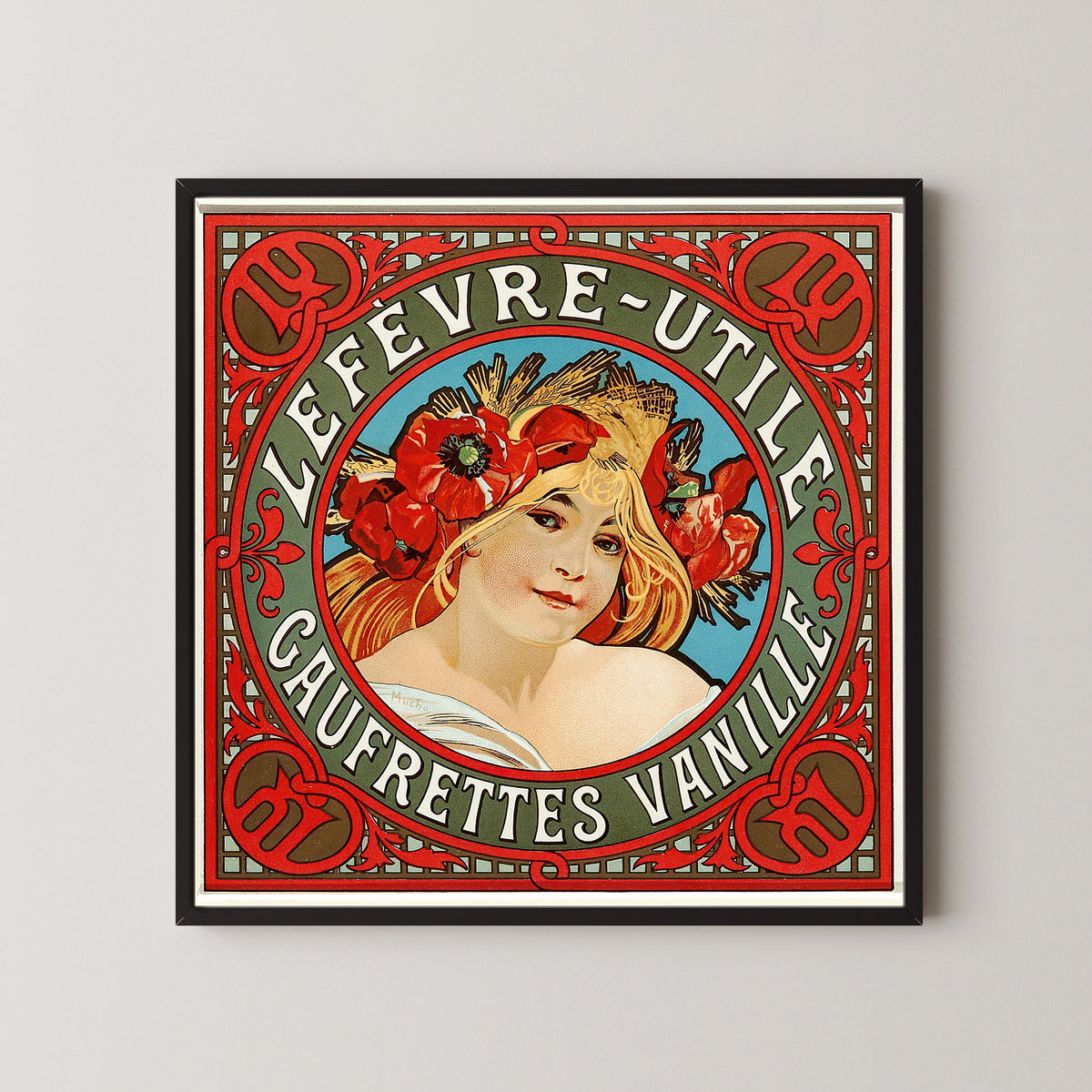 Framed art print of Lefèvre-Utile: Gaufrettes Vanille by Alphonse Mucha, in a black frame on a pale wall