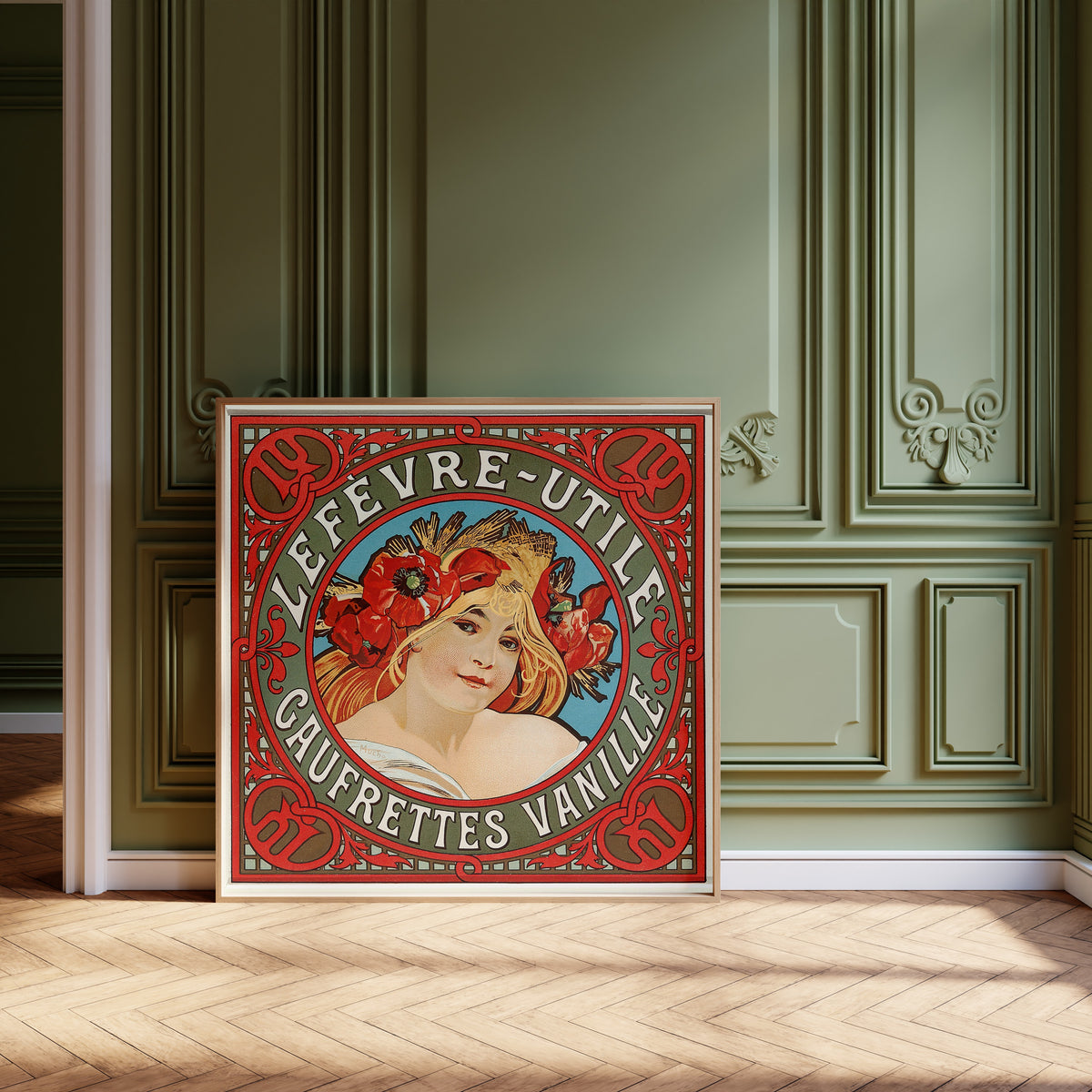 Framed art print of Lefèvre-Utile: Gaufrettes Vanille by Alphonse Mucha, leaning against olive-green panelling on a herringbone floor