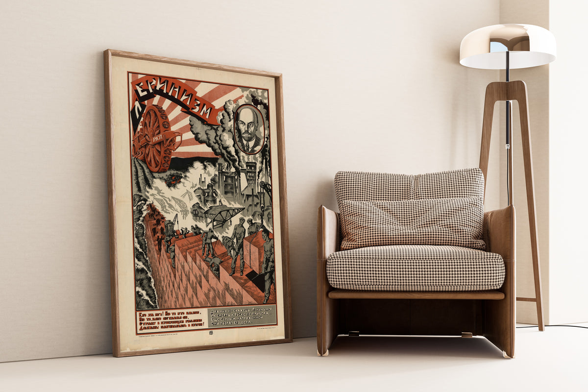 Framed art print of Leninism, leaning against a wall beside an armchair and a floor lamp
