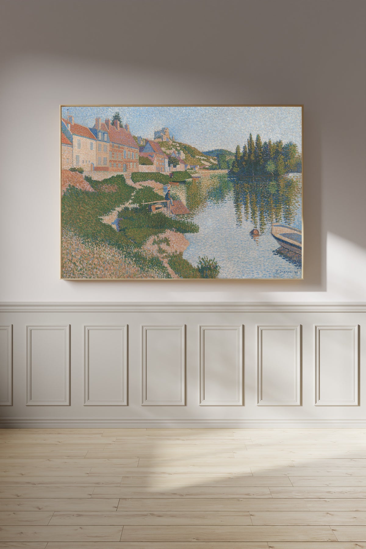 Framed art print of Les Andelys (1886) by Paul Signac, on a panelled wall in afternoon light