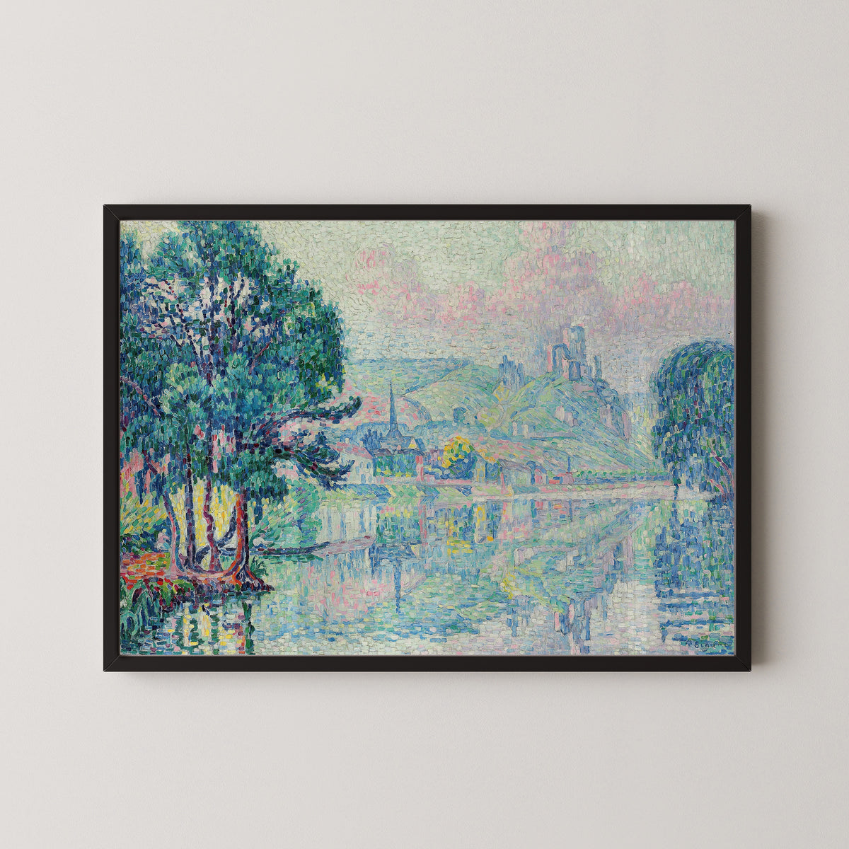 Framed art print of Les Andelys, Morning, Summer by Paul Signac, in a black frame on a pale wall