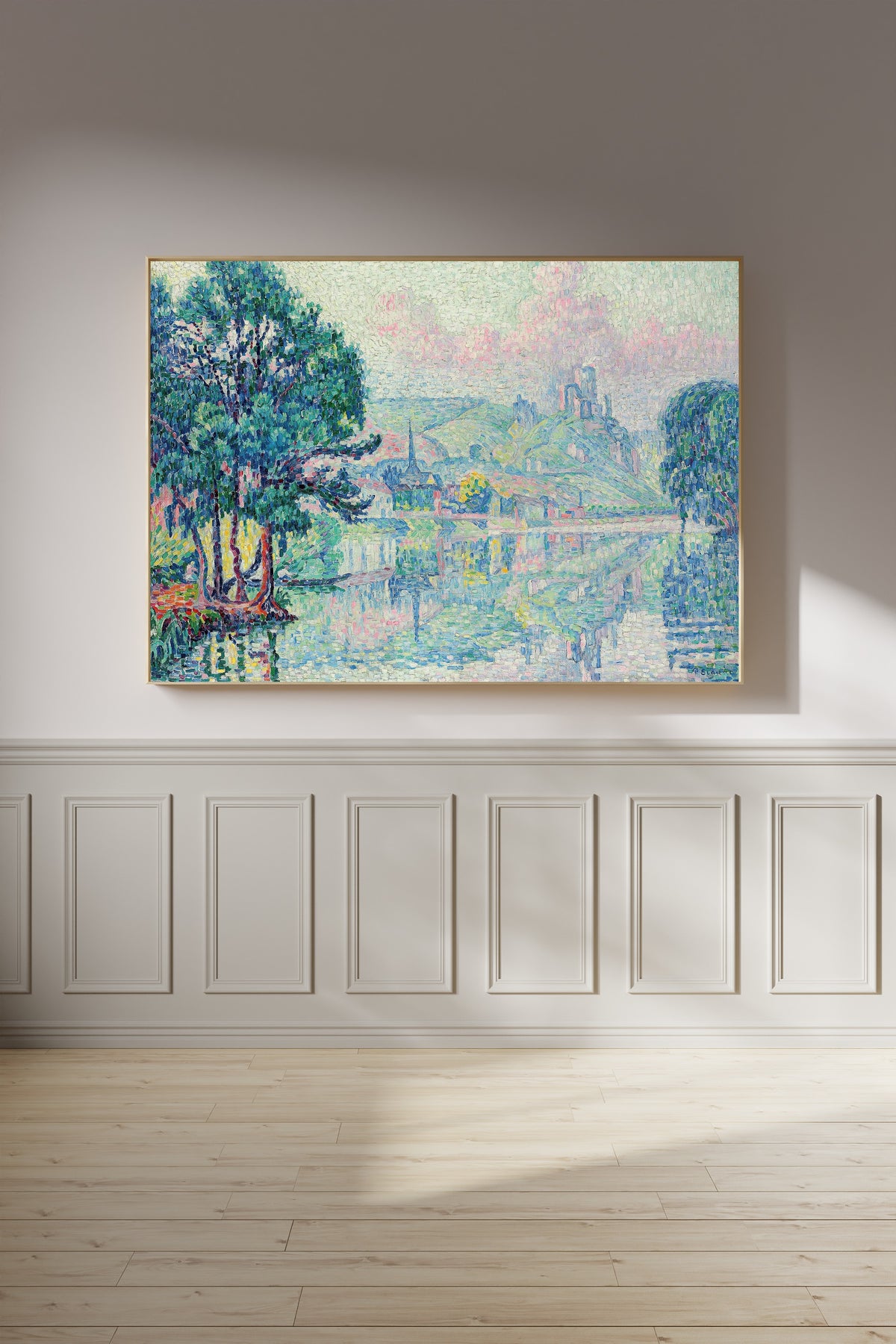 Framed art print of Les Andelys, Morning, Summer by Paul Signac, on a panelled wall in afternoon light