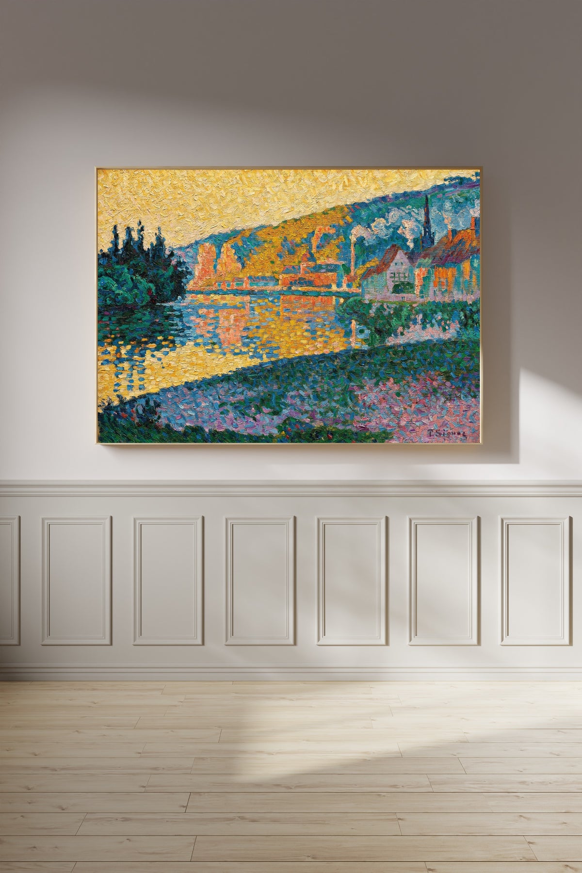 Framed art print of Les Andelys, Sunset by Paul Signac, on a panelled wall in afternoon light
