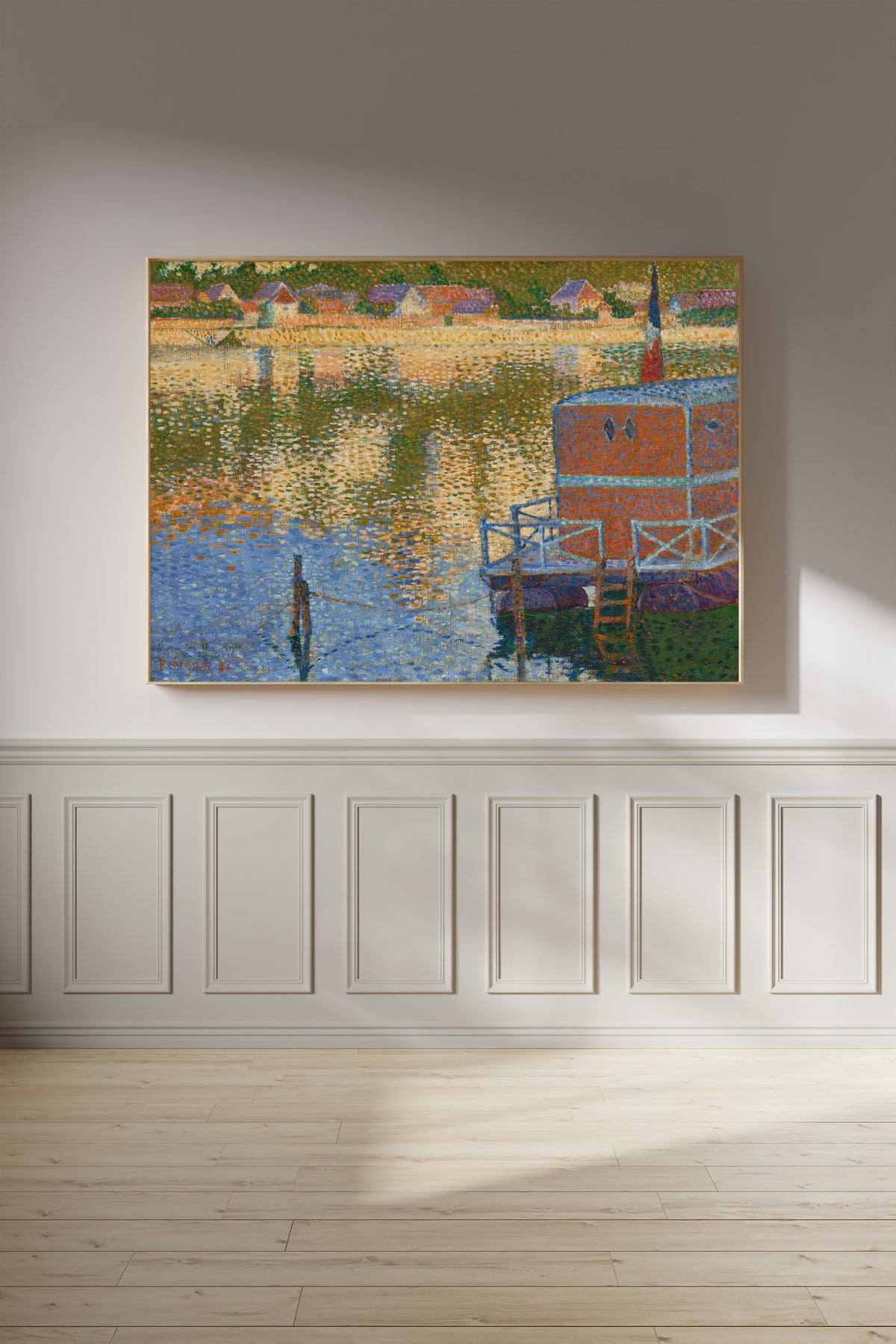 Framed art print of Les Andelys, The Baths by Paul Signac, on a panelled wall in afternoon light