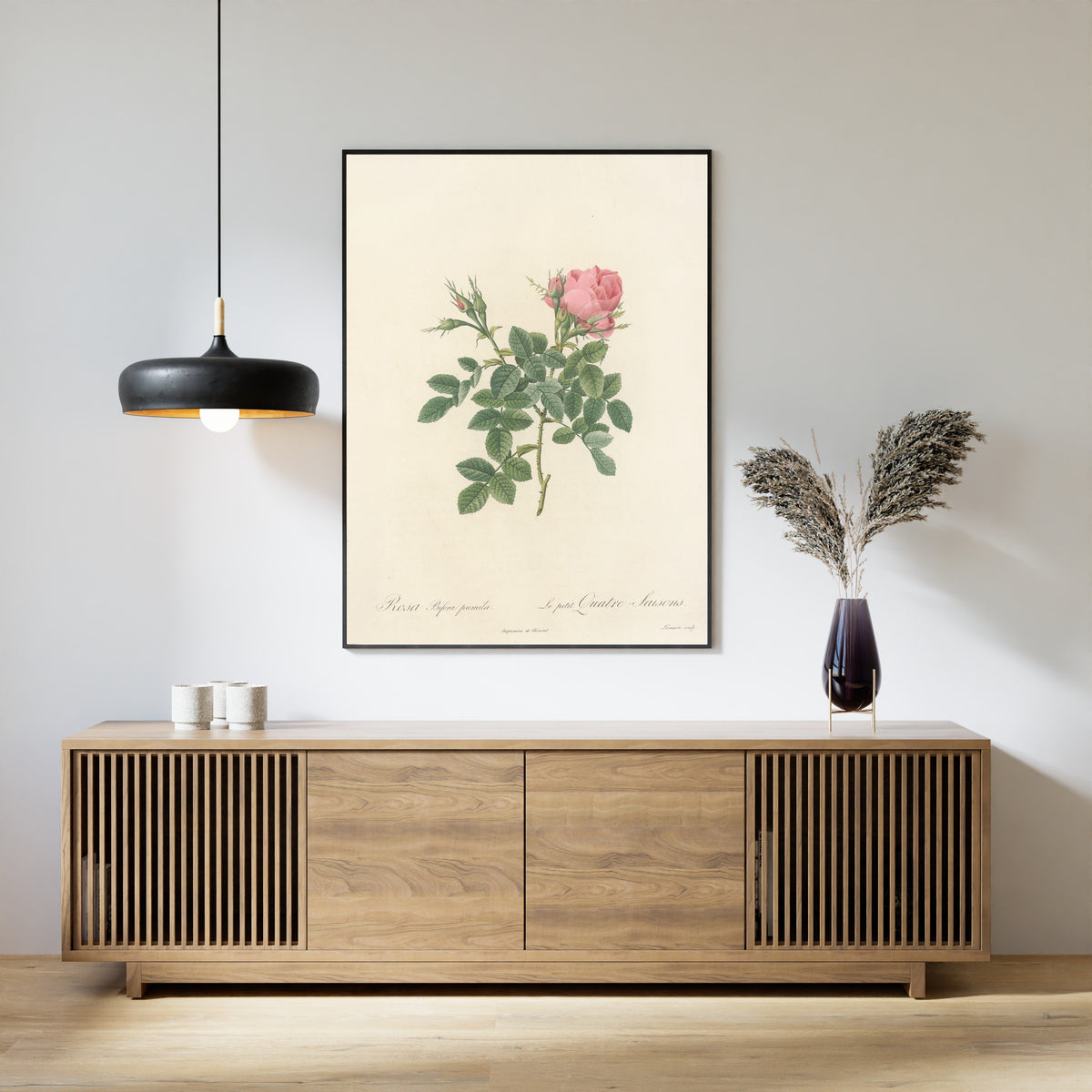 Framed art print of Les Roses: Rosa Bifera Pumila by Pierre-Joseph Redouté, above a slatted wood sideboard