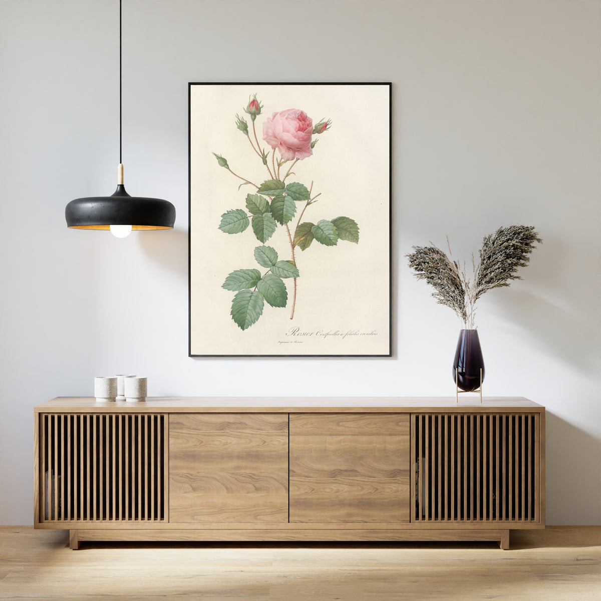 Framed art print of Les Roses: Rosa Centifolia Crenata by Pierre-Joseph Redouté, above a slatted wood sideboard