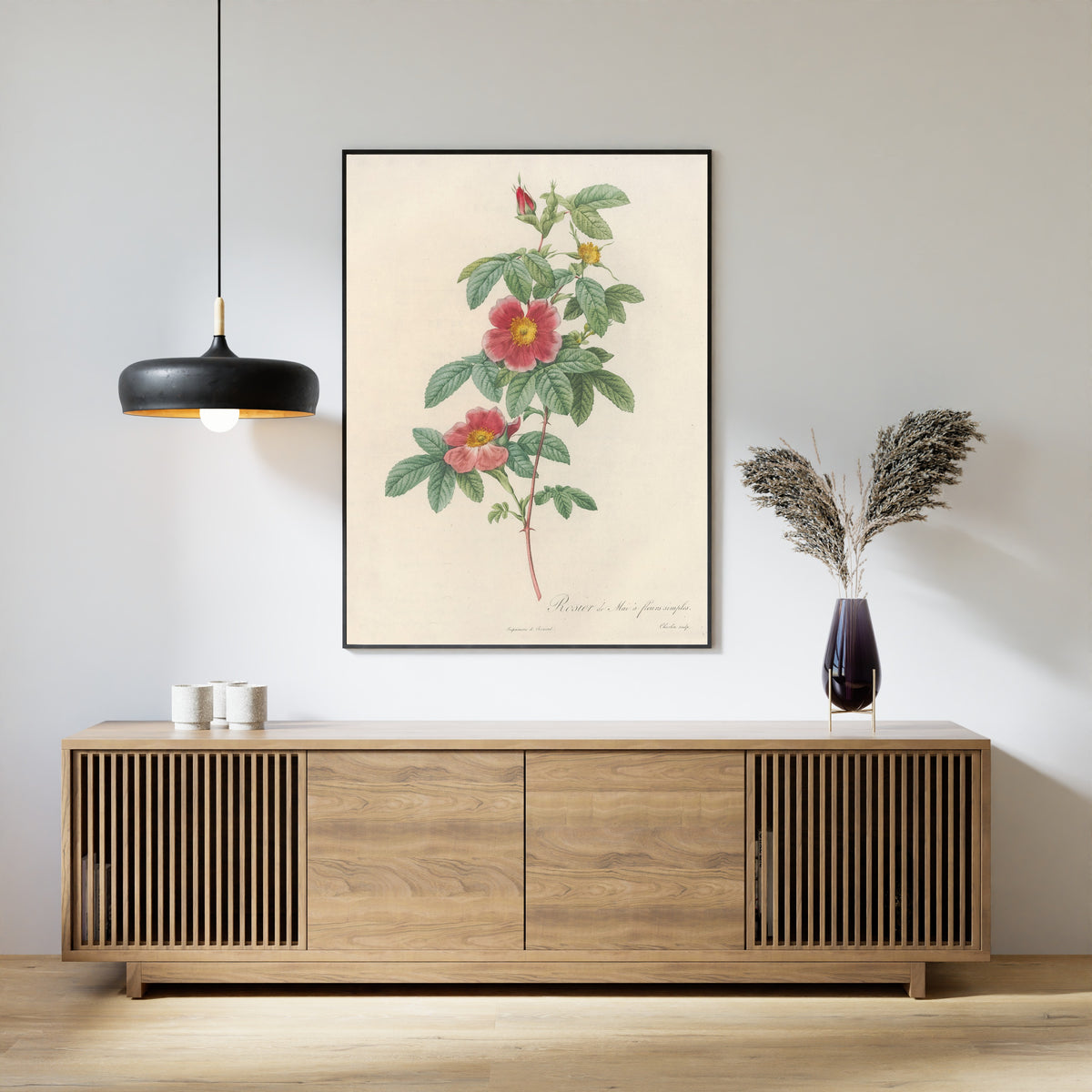 Framed art print of Les Roses: Rosa Cinnamomea Flore Simplici by Pierre-Joseph Redouté, above a slatted wood sideboard