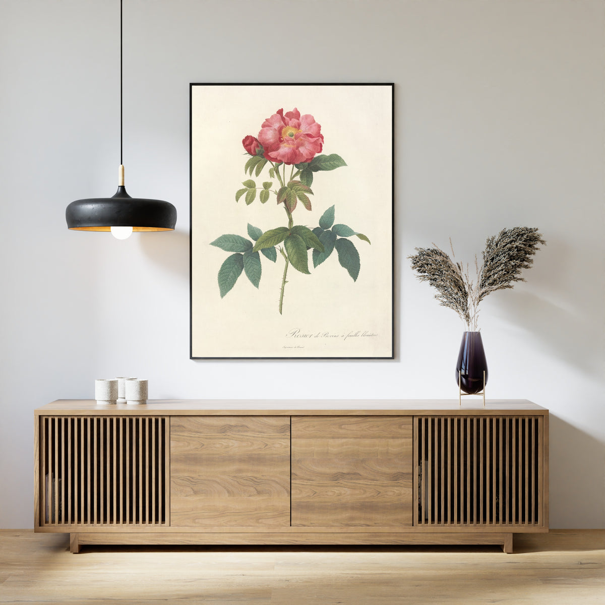 Framed art print of Les Roses: Rosa Gallica Caerulea by Pierre-Joseph Redouté, above a slatted wood sideboard