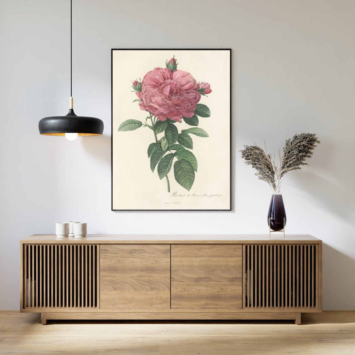 Framed art print of Les Roses: Rosa Gallica Flore giganteo by Pierre-Joseph Redouté, above a slatted wood sideboard