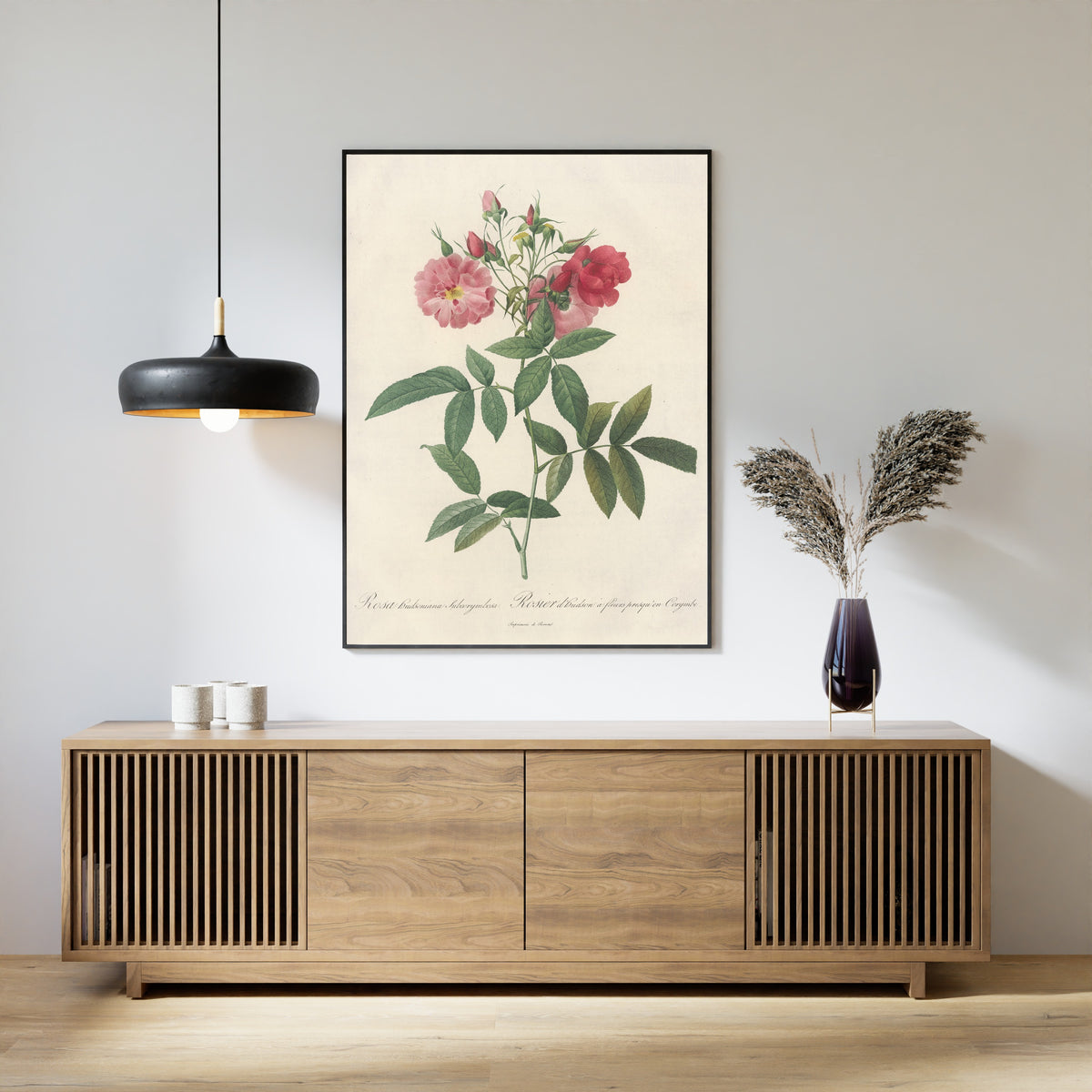 Framed art print of Les Roses: Rosa Hudsoniana Subcorymbosa by Pierre-Joseph Redouté, above a slatted wood sideboard