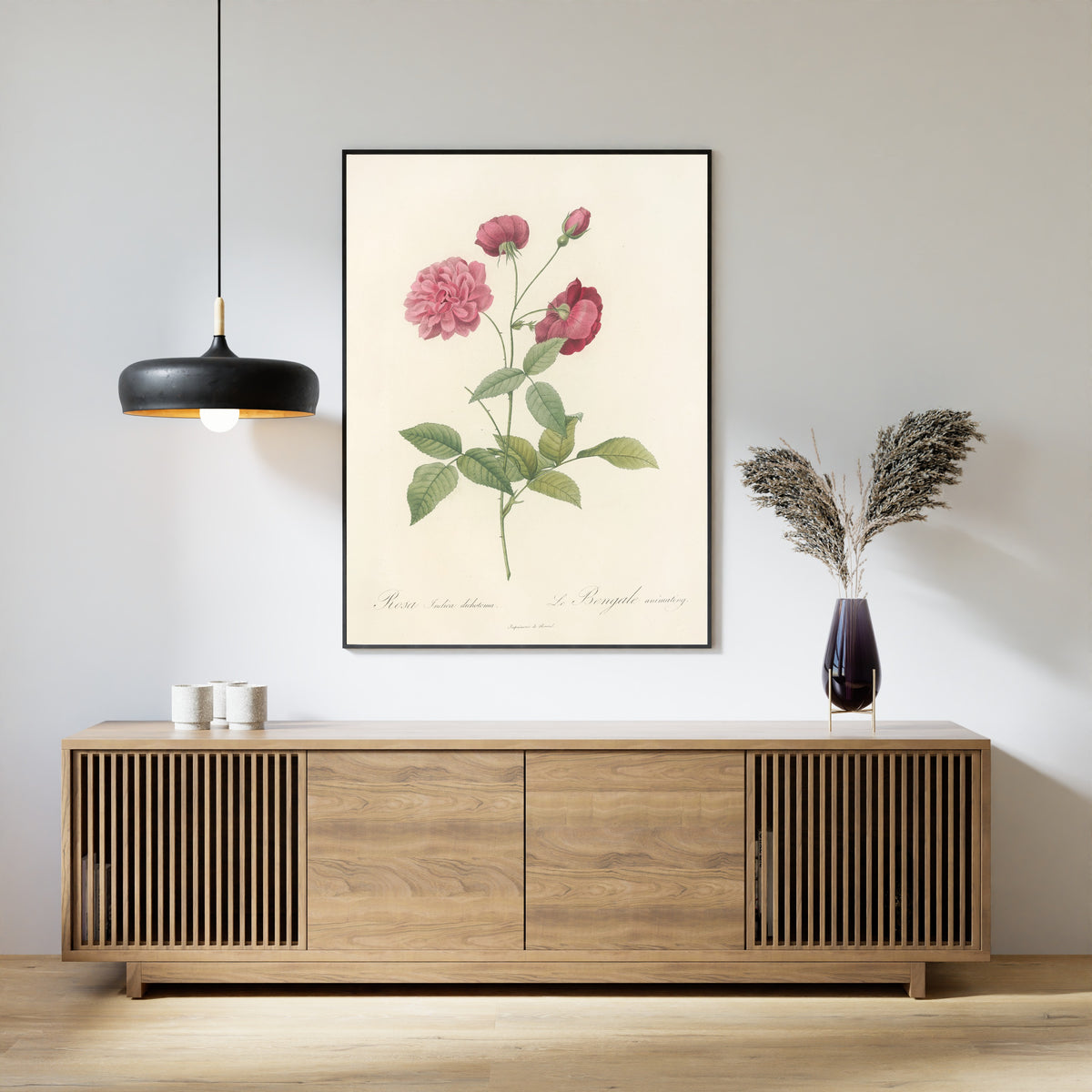 Framed art print of Les Roses: Rosa Indica Dichotoma by Pierre-Joseph Redouté, above a slatted wood sideboard