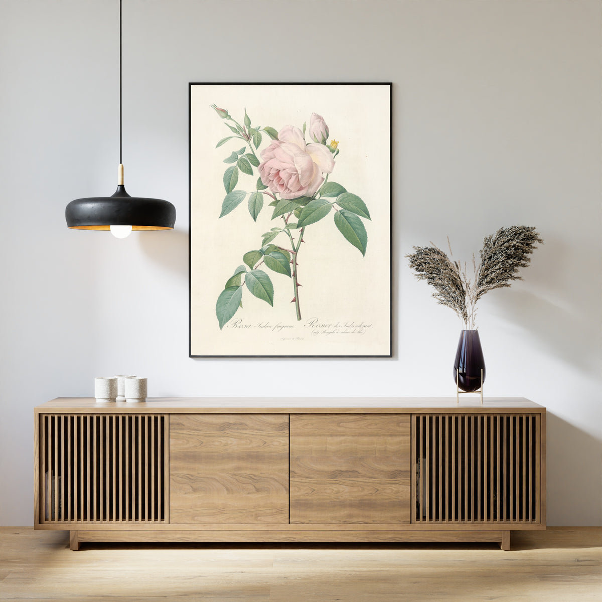 Framed art print of Les Roses: Rosa Indica Fragrans by Pierre-Joseph Redouté, above a slatted wood sideboard
