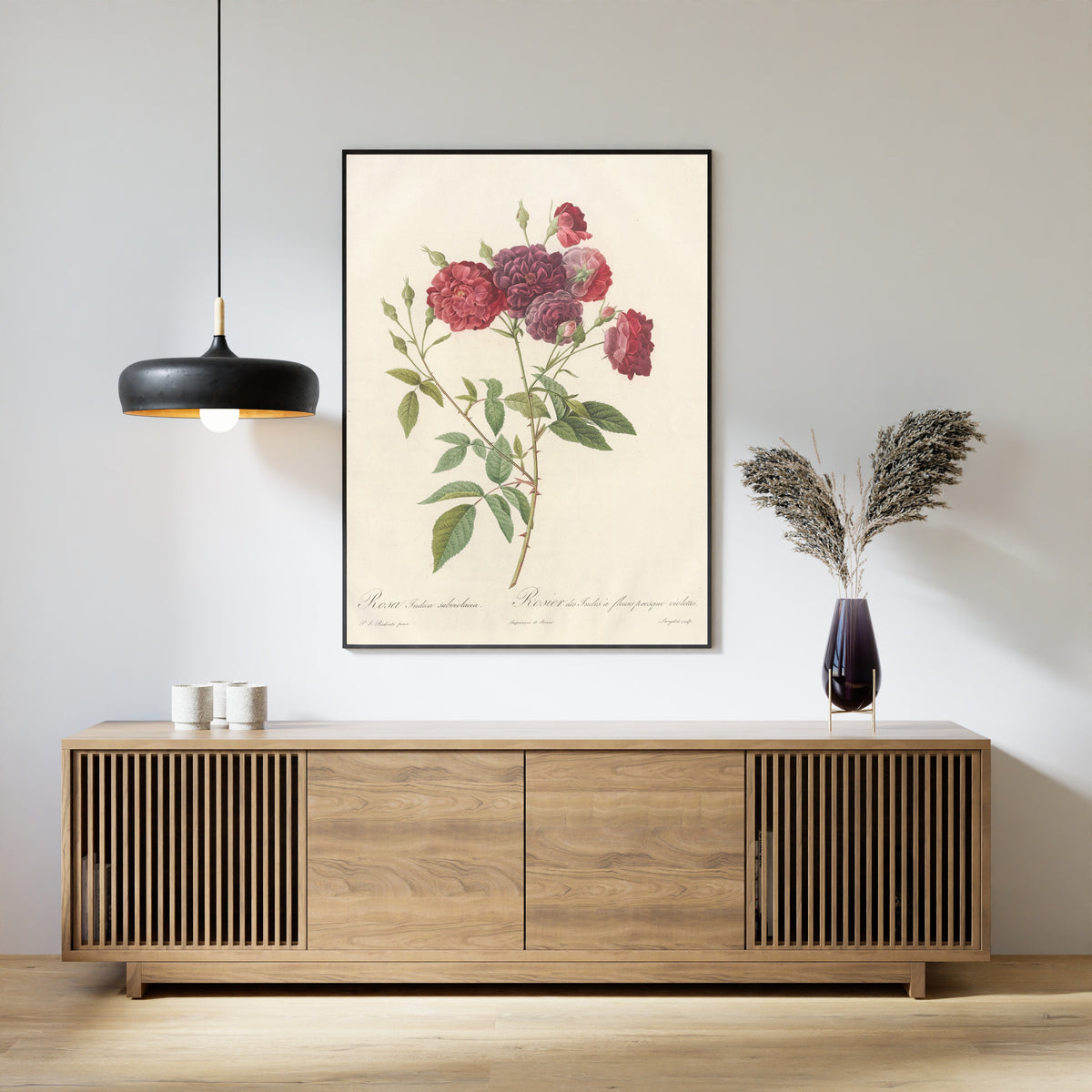 Framed art print of Les Roses: Rosa Indica Subviolacea by Pierre-Joseph Redouté, above a slatted wood sideboard