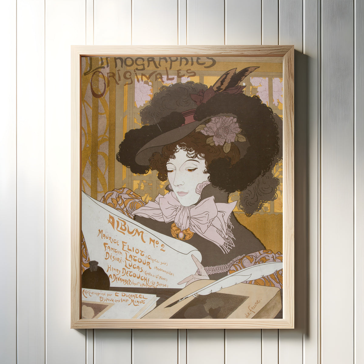 Framed art print of Lithographies originales, Album No 2 by Georges de Feure, in a light wood frame on a white panelled wall