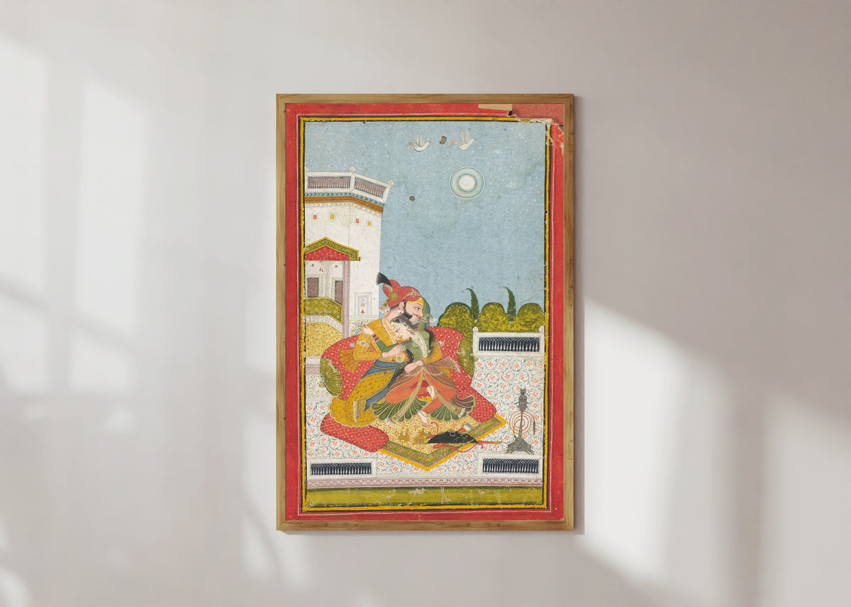 Framed art print of Lovers Embracing (Raga Malkaus) by Bundi school, in a light wood frame on a sunlit white wall