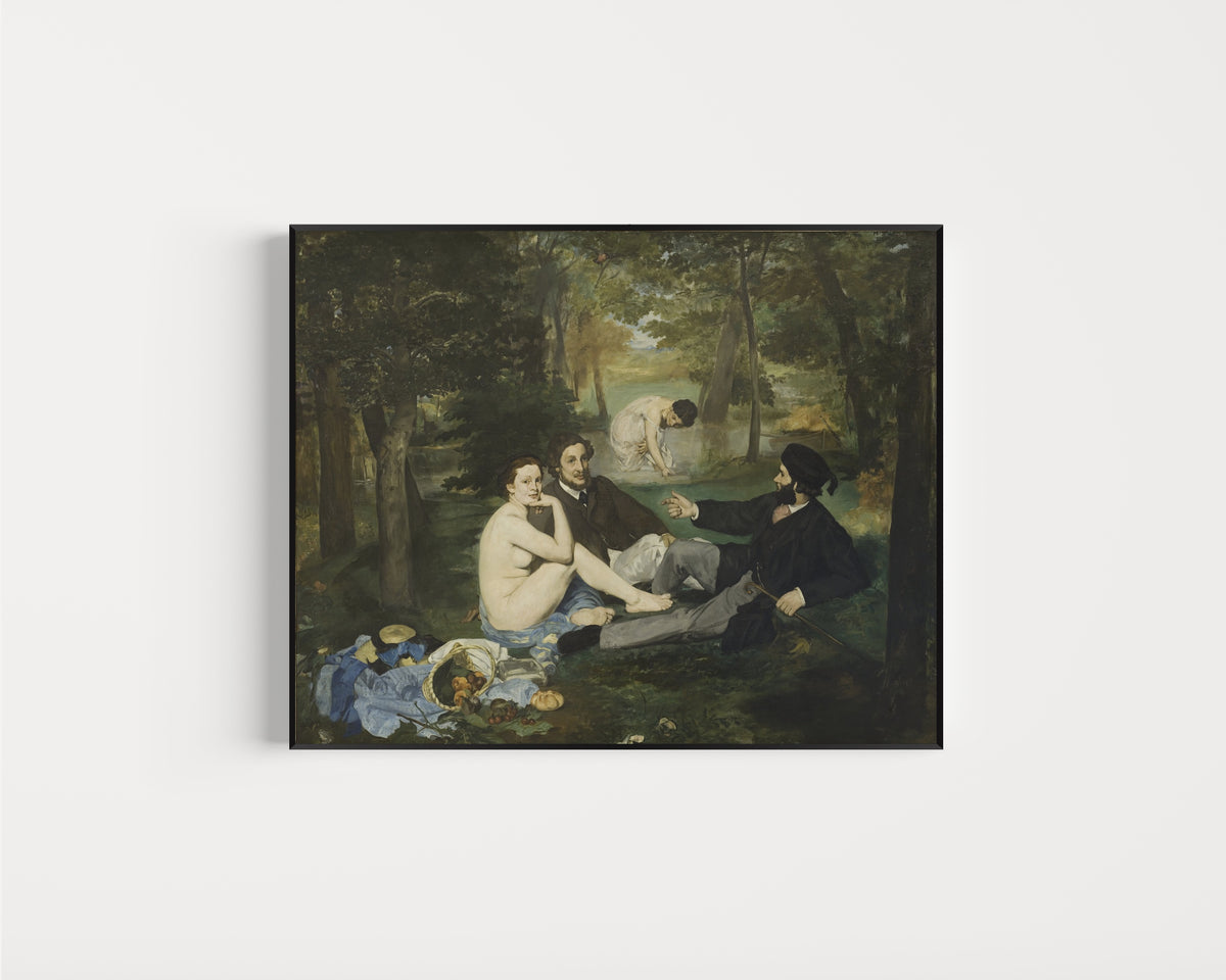 Framed art print of Luncheon on the Grass by Édouard Manet, in a slim black frame on a plain white wall