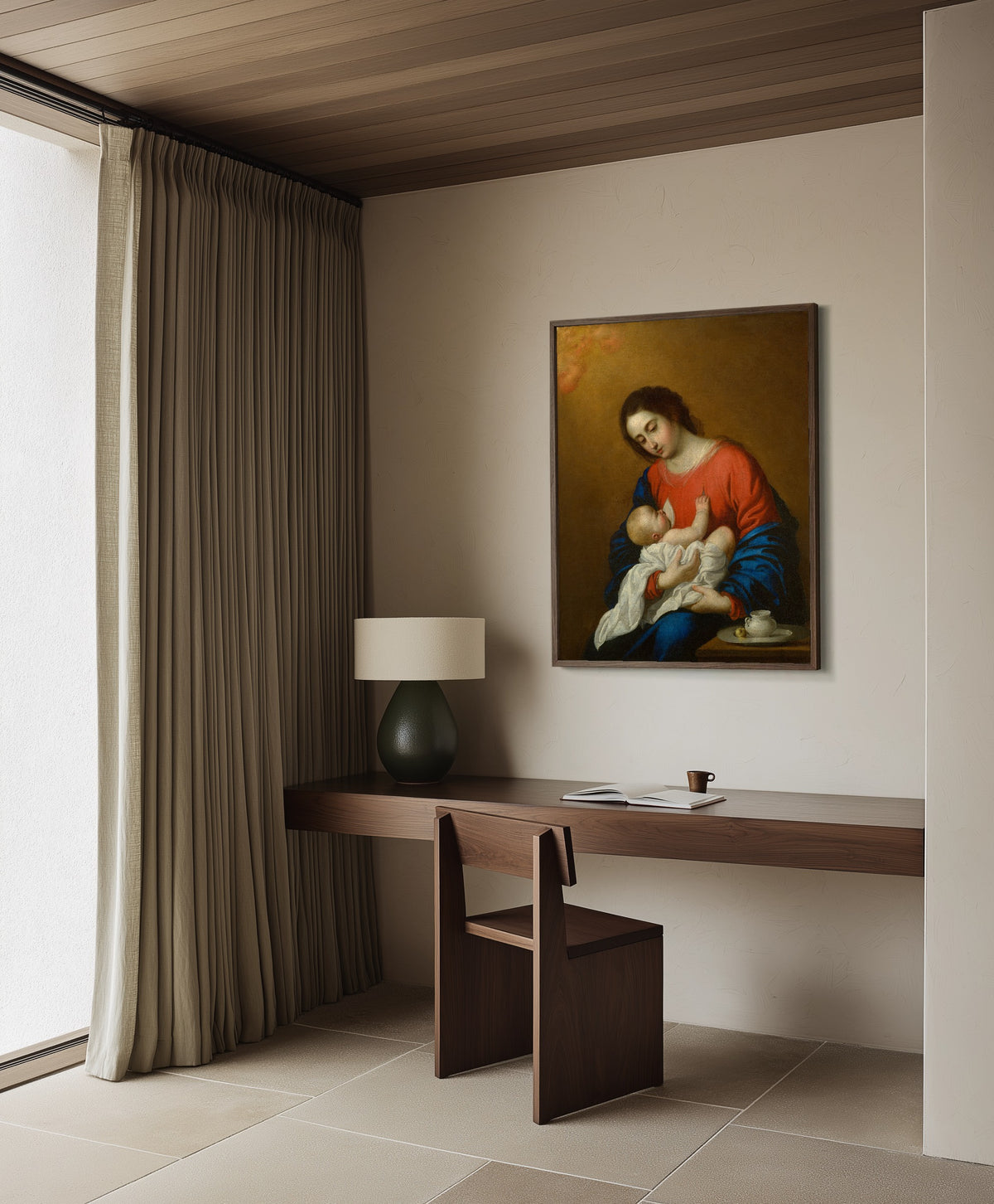 Framed art print of Madonna and Child by Francisco de Zurbarán, in a dark wood frame on a plaster wall above a walnut desk