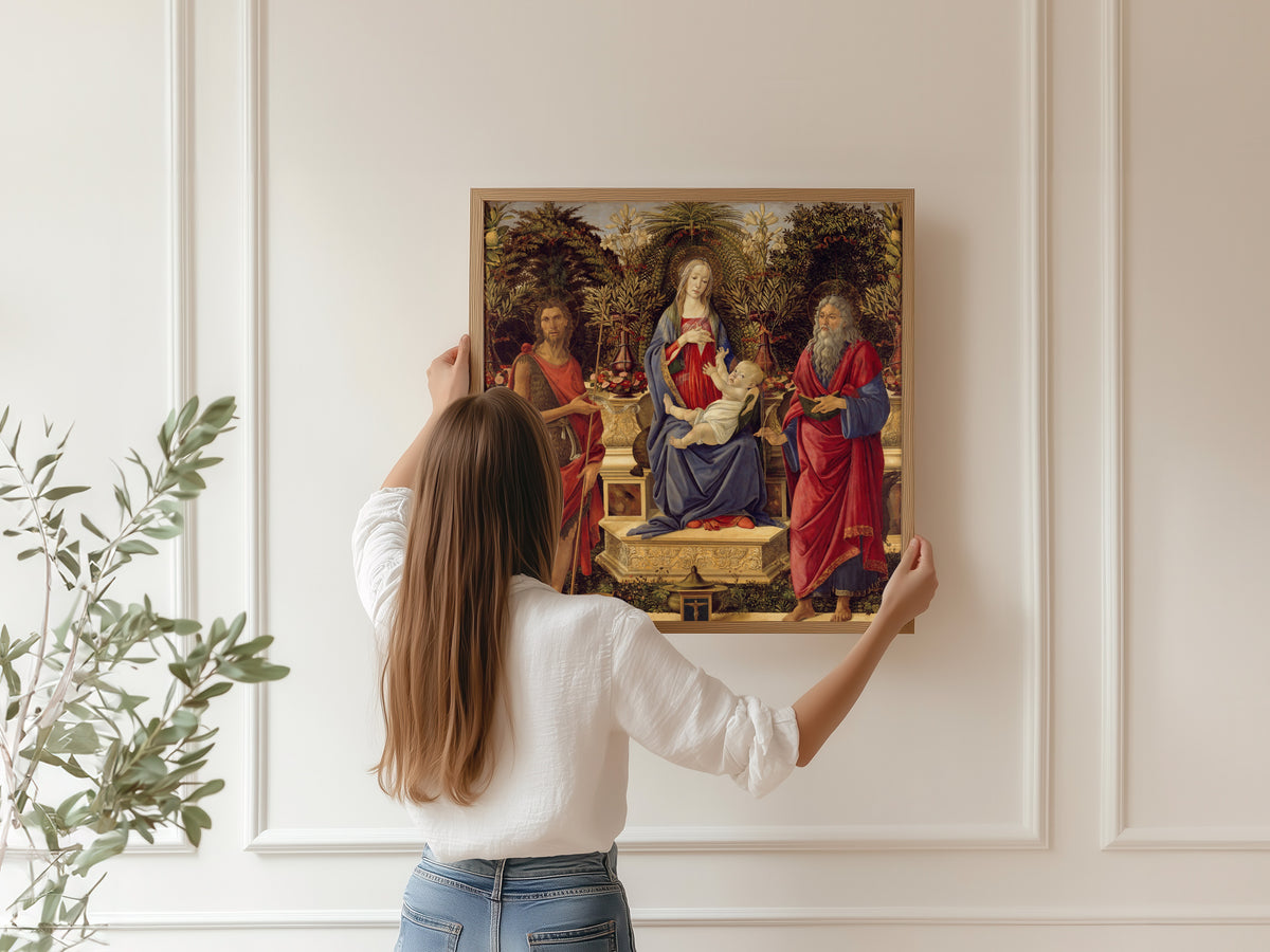 Framed art print of Madonna and Child with both Saints John by Sandro Botticelli, hung on a panelled wall