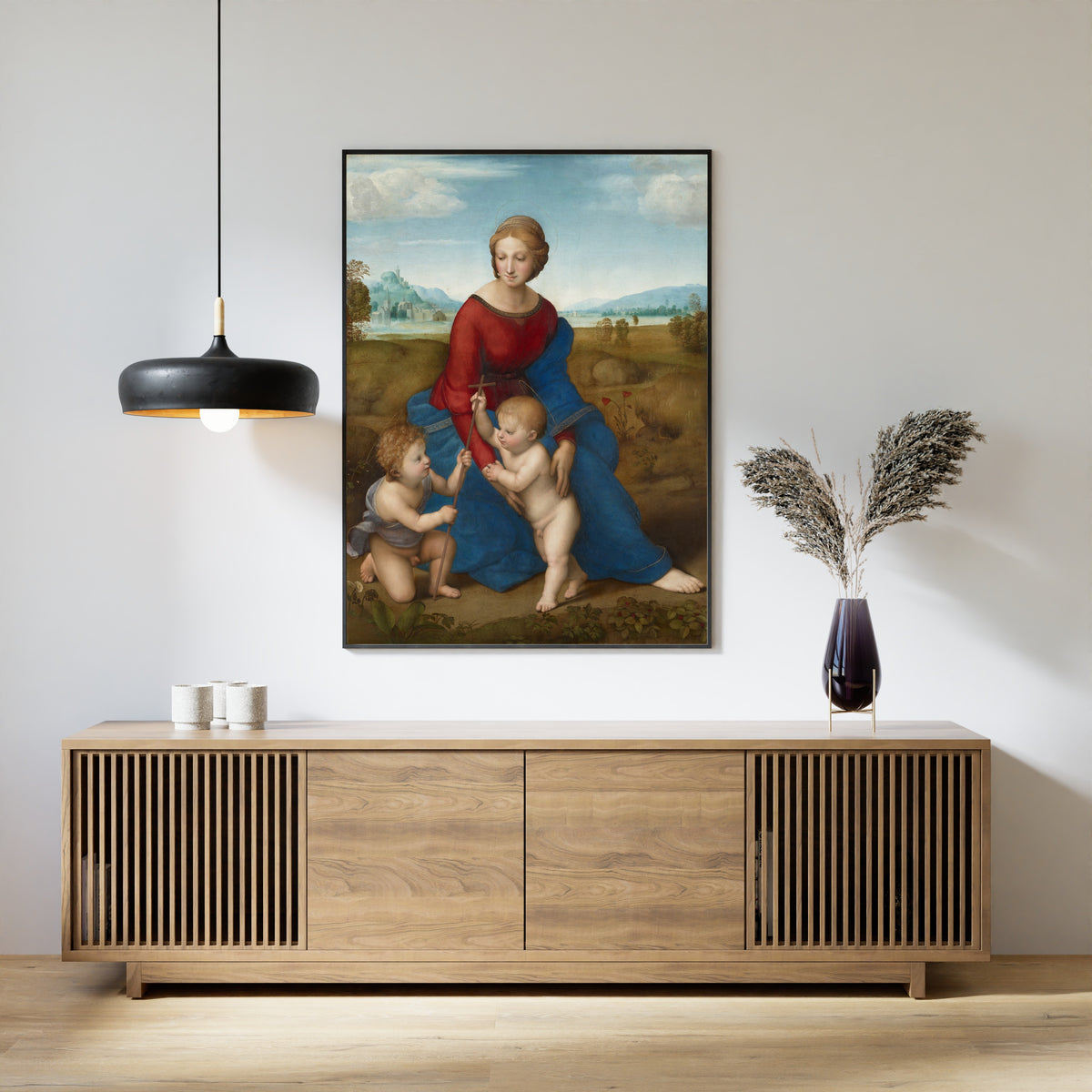 Framed art print of Madonna in the Meadow by Raphael, above a slatted wood sideboard