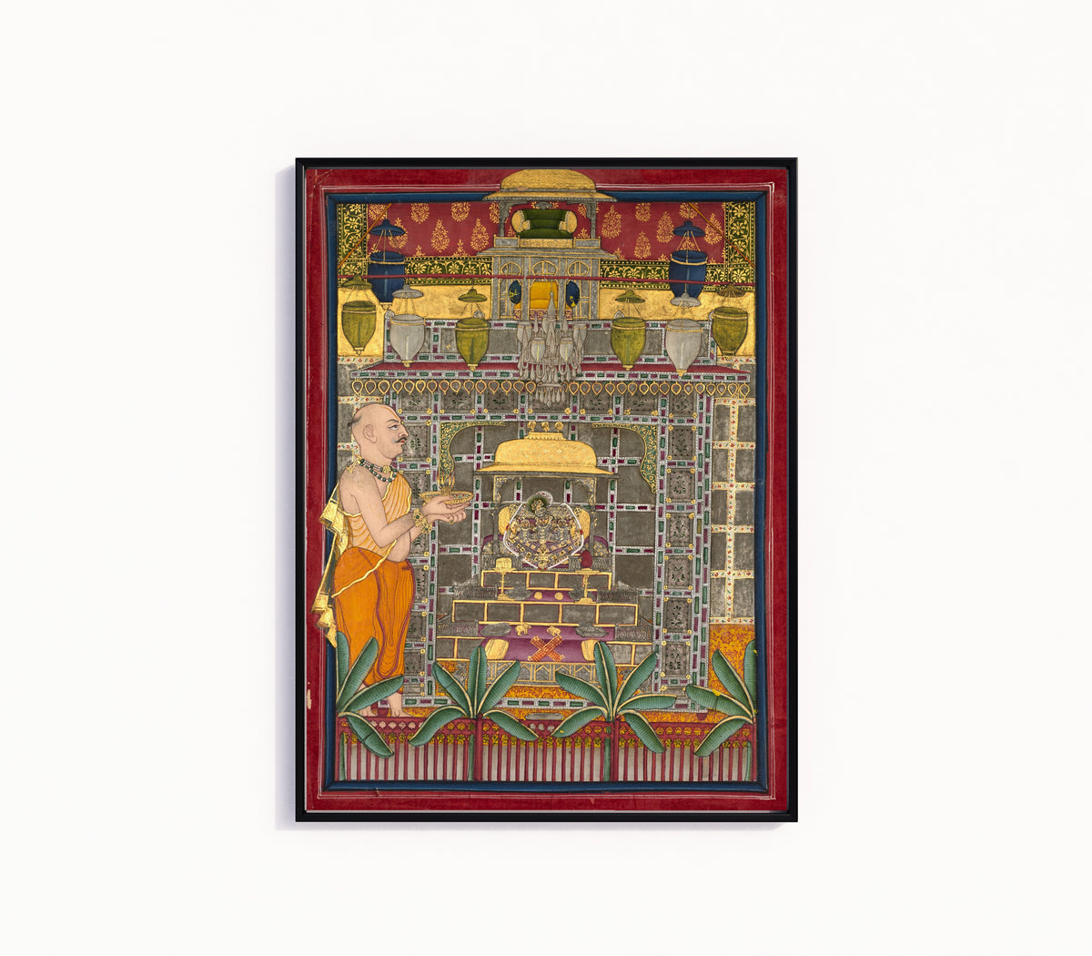 Framed art print of Maharao Kishor Singh II of Kota (r. 1819–28) Worshiping Krishna as Brij Rajji by Kota school, in a slim black frame on a plain white wall