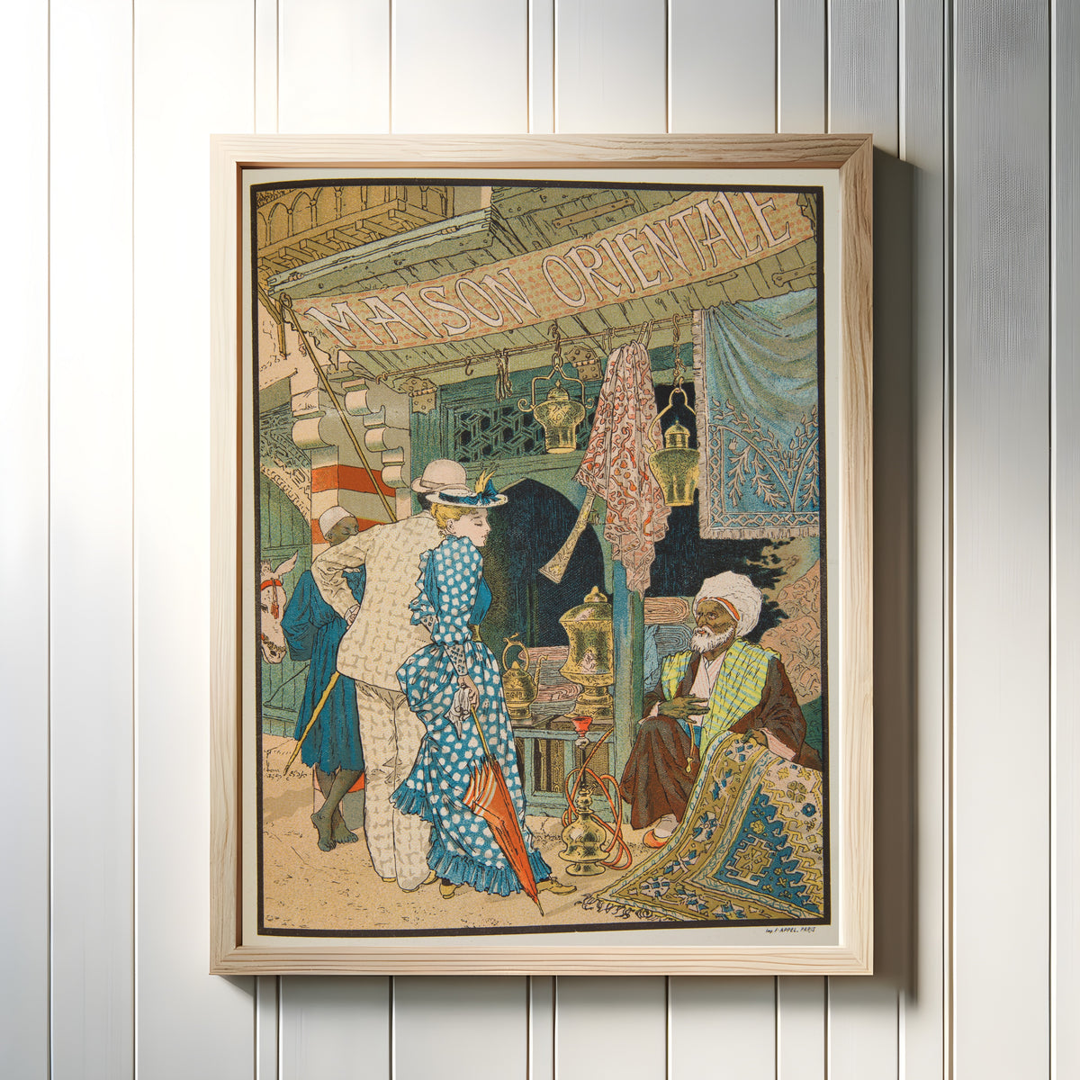 Framed art print of Maison Orientale by Eugène Grasset, in a light wood frame on a white panelled wall