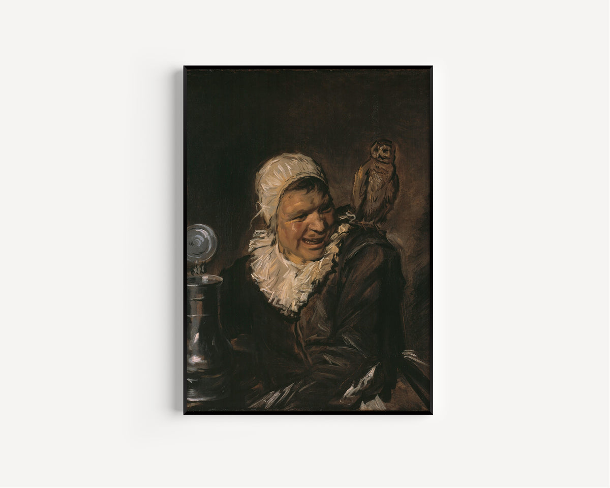Framed art print of Malle Babbe by Frans Hals, in a slim black frame on a plain white wall