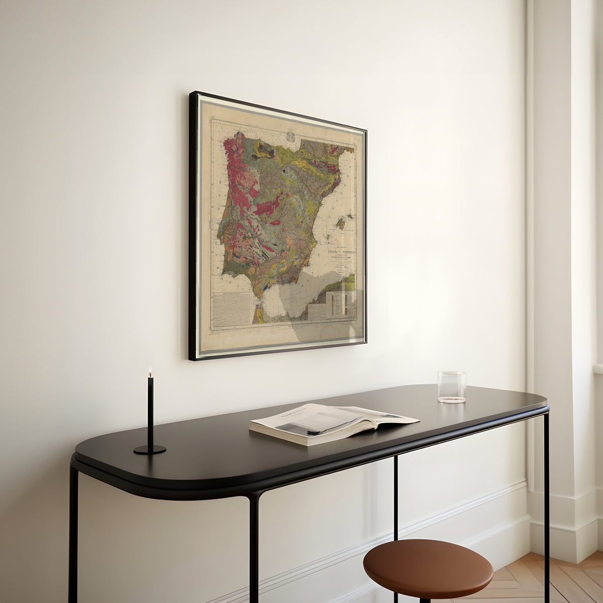 Mapa geológico de España y Portugal by Federico de Botella y de Hornos — framed above a slim black console table