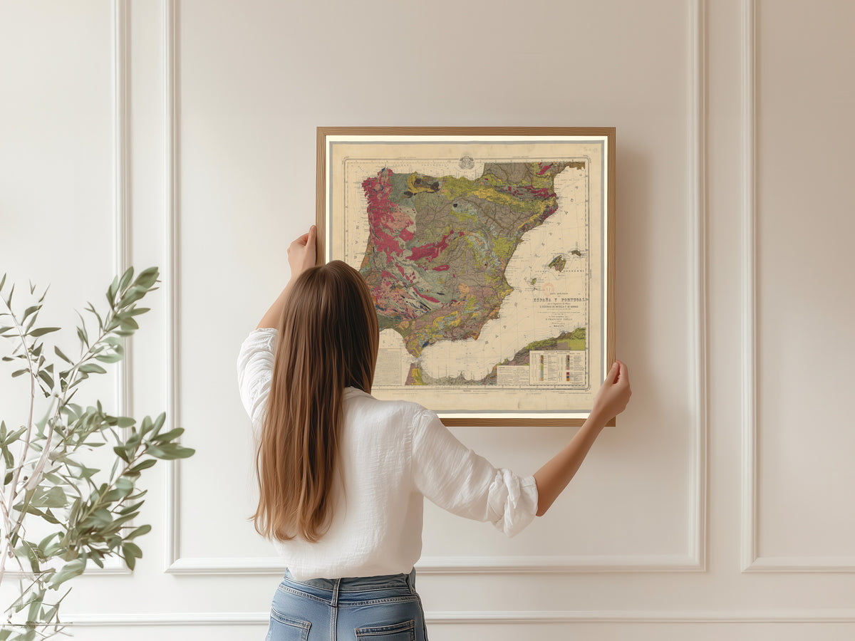 Mapa geológico de España y Portugal by Federico de Botella y de Hornos — being hung, framed, on a panelled wall