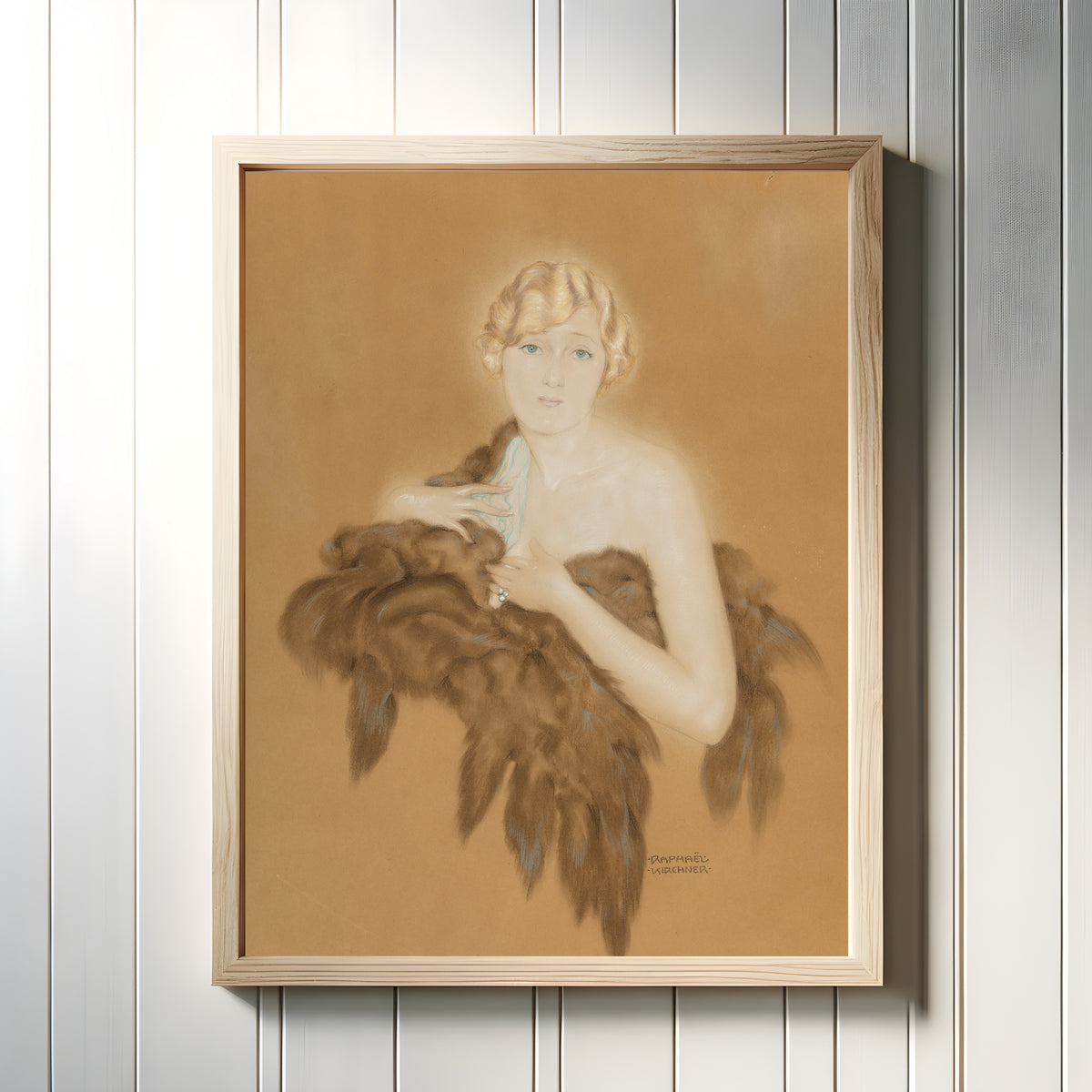 Framed art print of Marion Davis by Raphael Kirchner, in a light wood frame on a white panelled wall