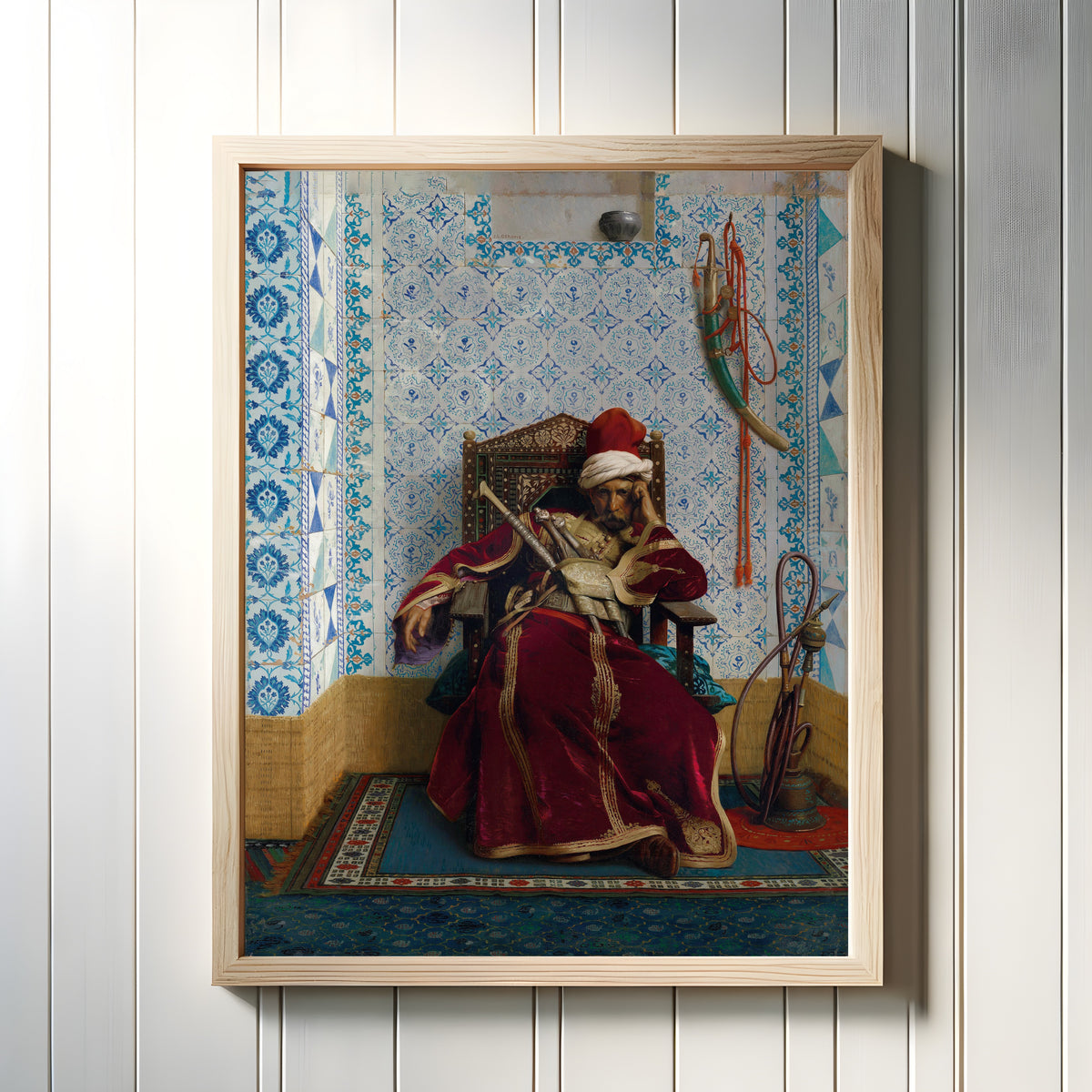 Framed art print of Markos Botsaris by Jean-Léon Gérôme, in a light wood frame on a white panelled wall