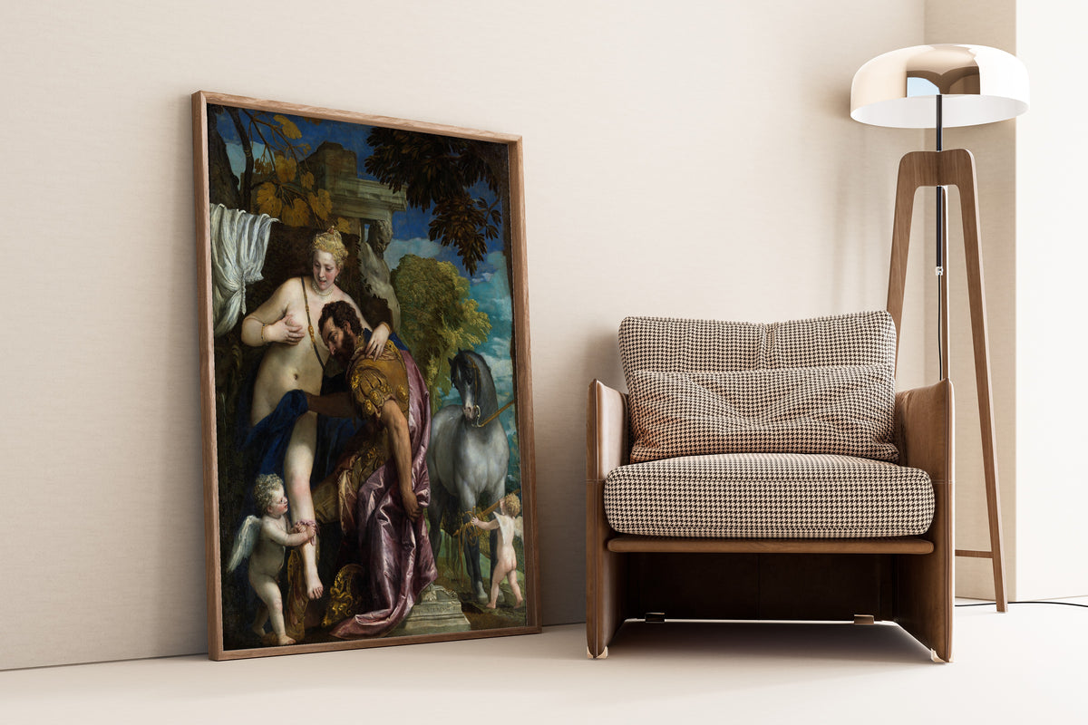 Framed art print of Mars and Venus United by Love by Paolo Veronese, leaning against a wall beside an armchair and a floor lamp