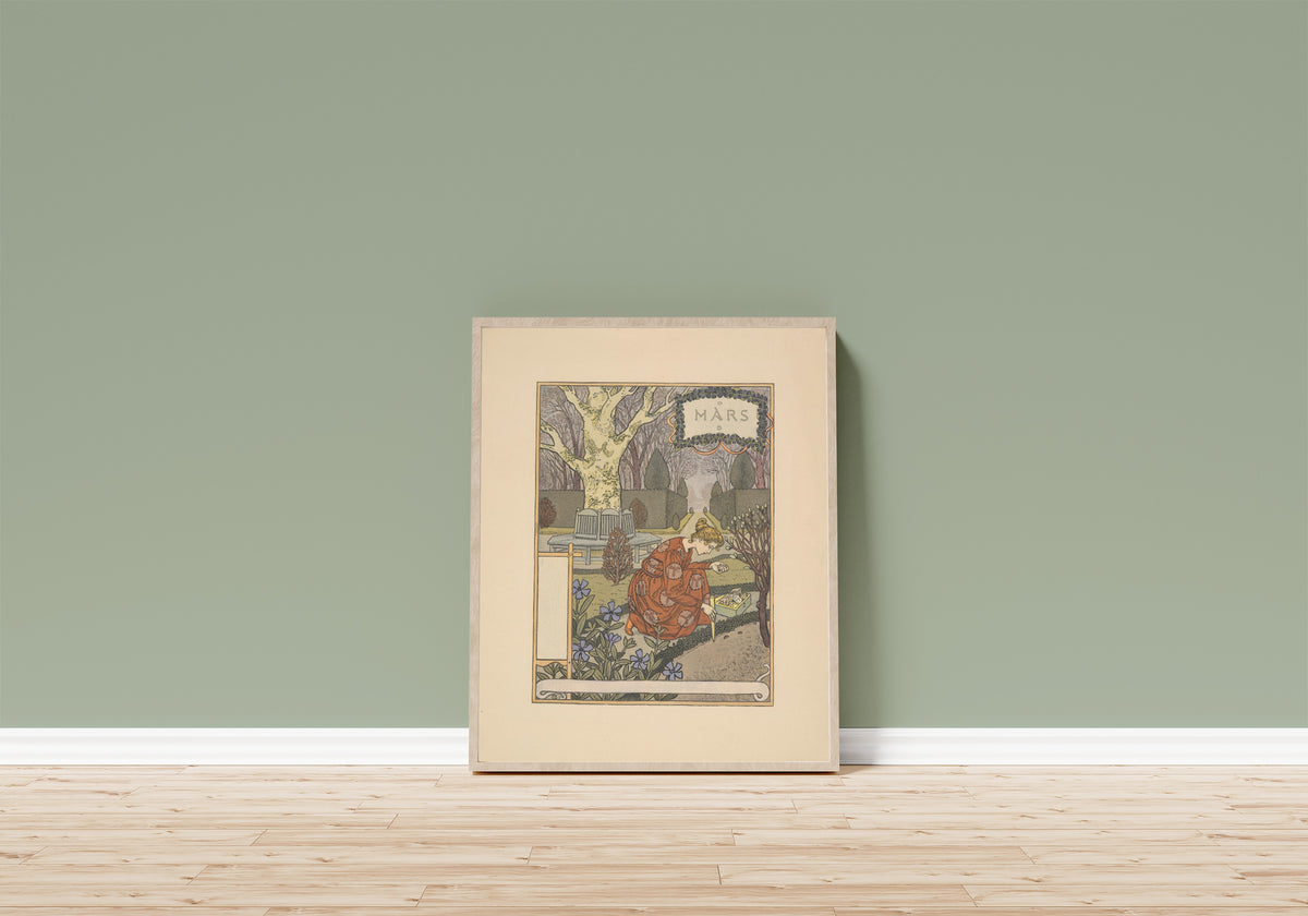 Framed art print of Mars by Eugène Grasset, in a light wood frame leaning on a sage green wall above a wooden floor