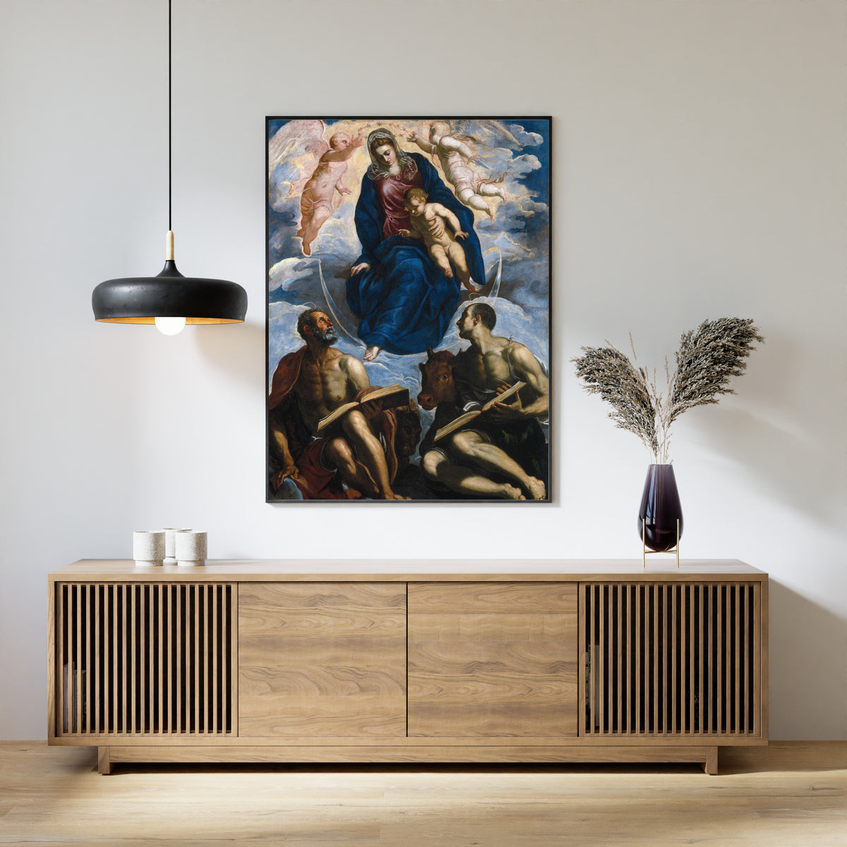 Framed art print of Mary with the Child, Venerated by St. Marc and St. Luke by Tintoretto, above a slatted wood sideboard