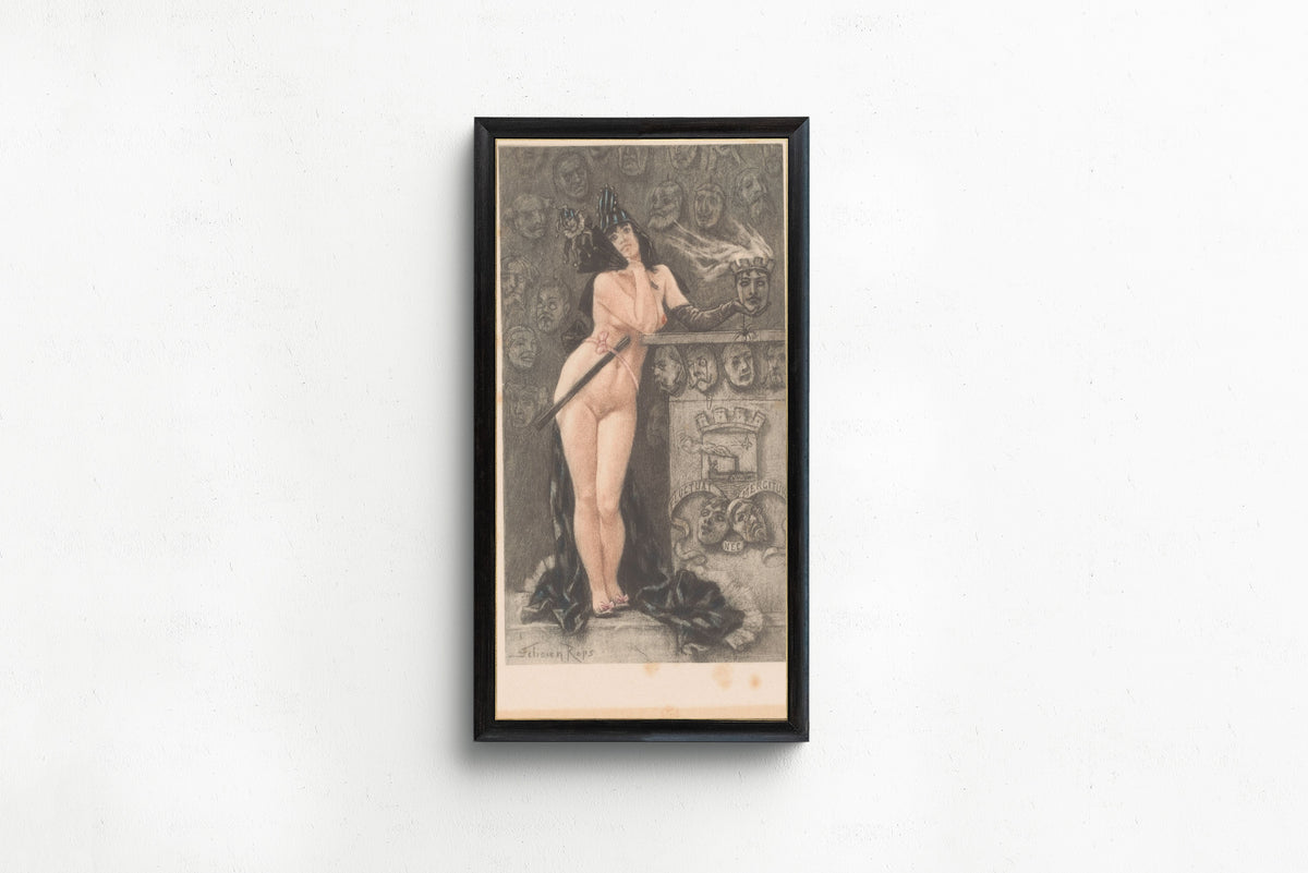 Framed art print of Masques parisiennes (hand-coloured) by Félicien Rops, in a slim black frame on a plain white wall