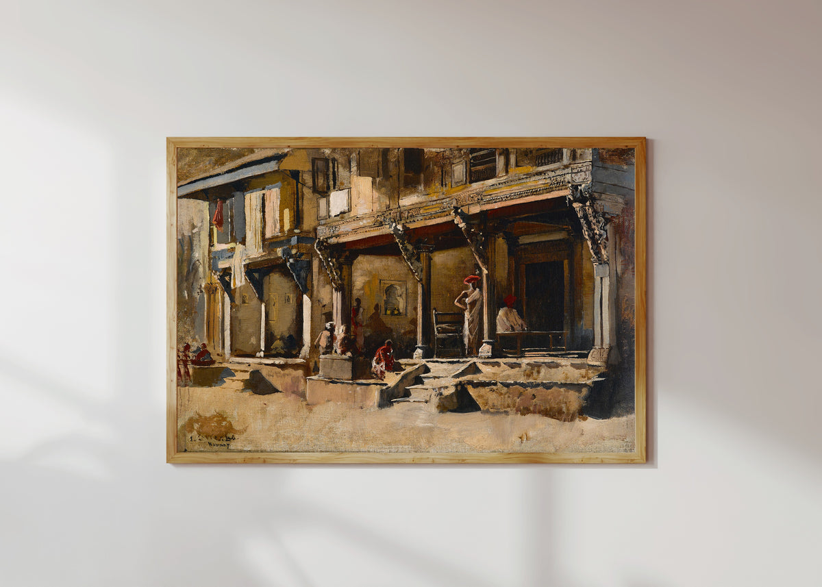 Framed art print of Merchants in Bombay by Edwin Lord Weeks, in a light wood frame on a sunlit white wall