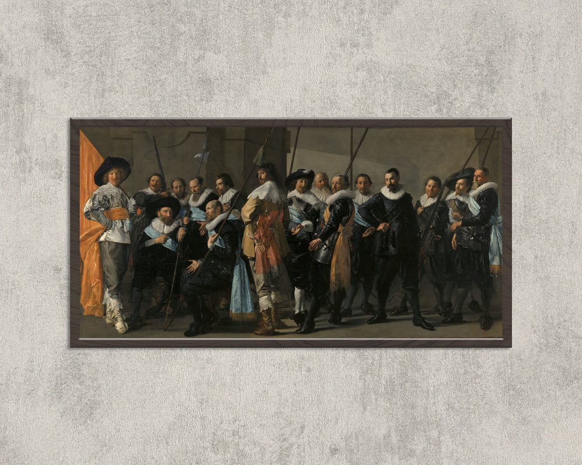 Framed art print of Militia Company of District XI under the Command of Captain Reynier Reael, Known… by Frans Hals, in a wide black frame on a concrete wall