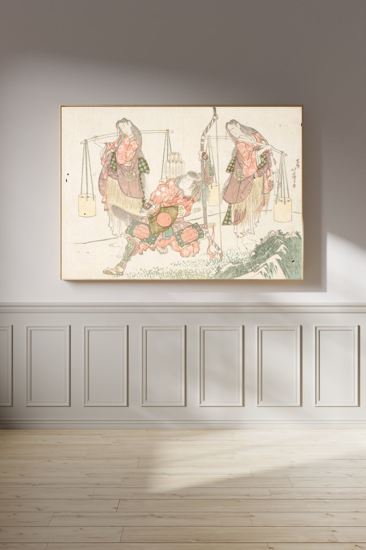 Framed art print of Minamoto no Tametomo and Two Salt Gatherers by Katsushika Hokusai, on a panelled wall in afternoon light