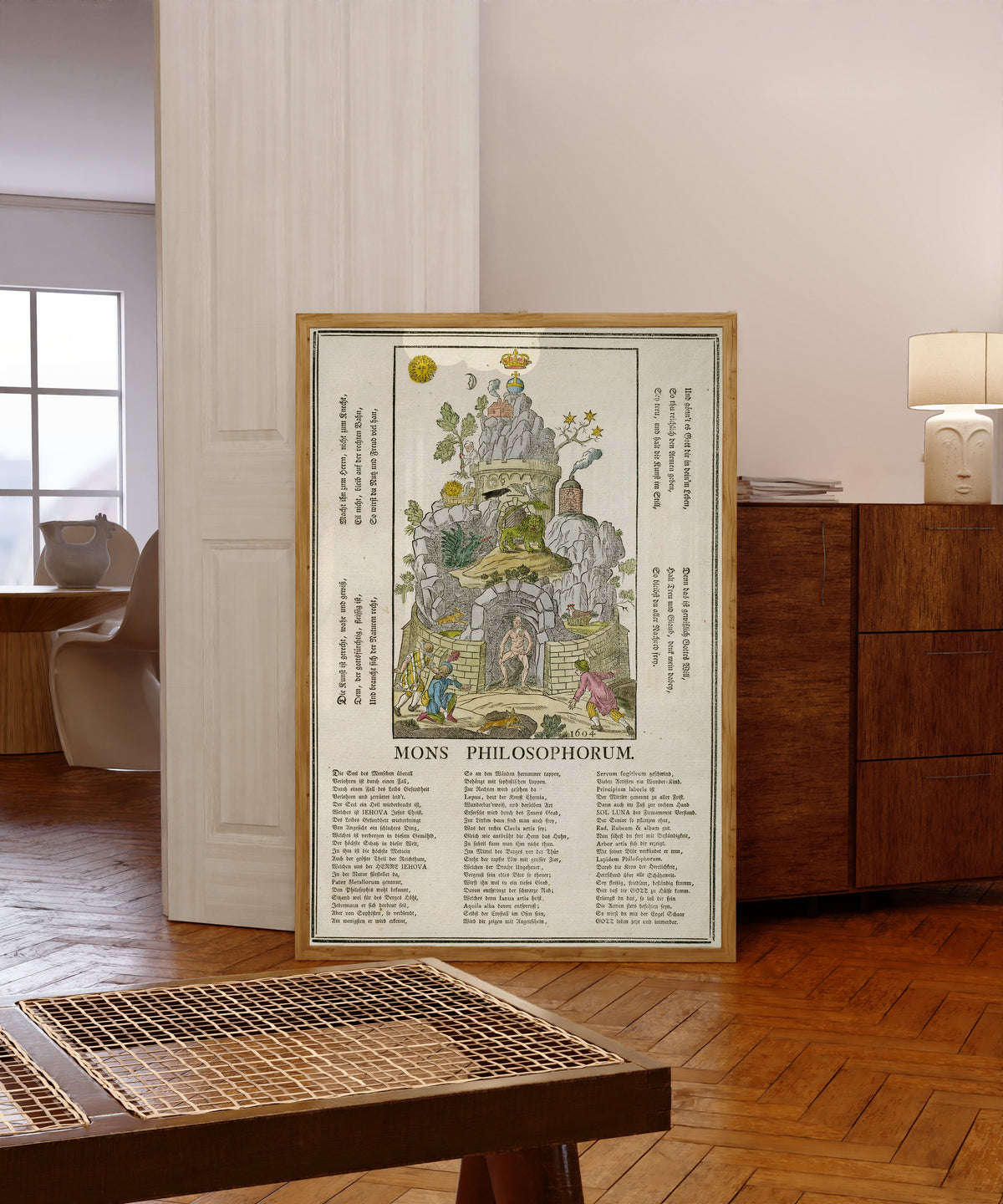 Framed art print of Mons Philosophorum: the Mountain of the Philosophers by Unknown artist, in a light wood frame leaning in a warm room with a parquet floor