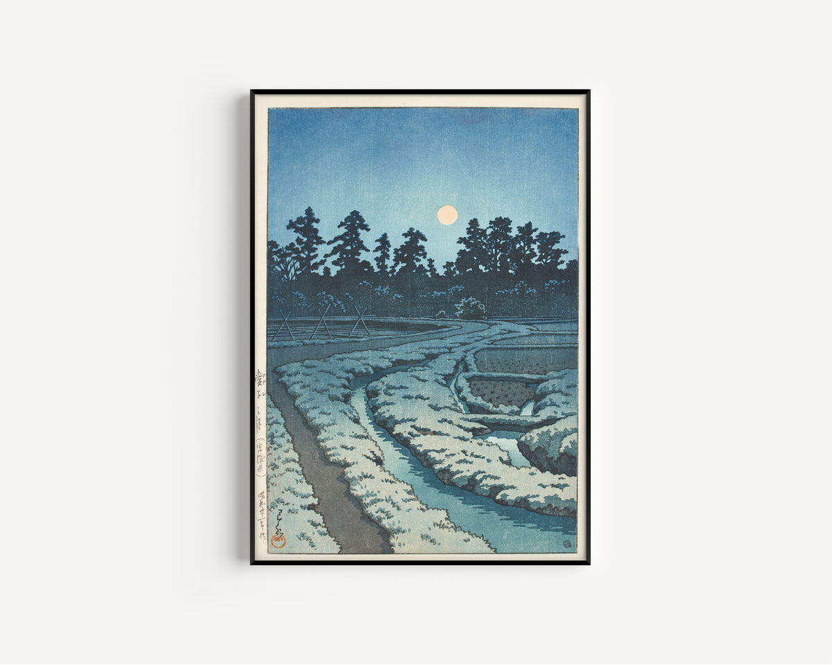 Framed art print of Moon at Ayashi, Miyagi Prefecture by Kawase Hasui, in a slim black frame on a plain white wall