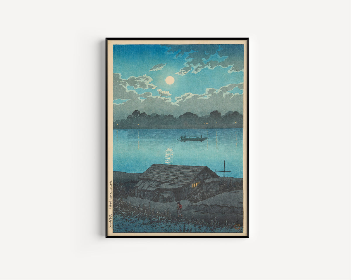 Framed art print of Moon on the Arakawa River in Akabane by Kawase Hasui, in a slim black frame on a plain white wall