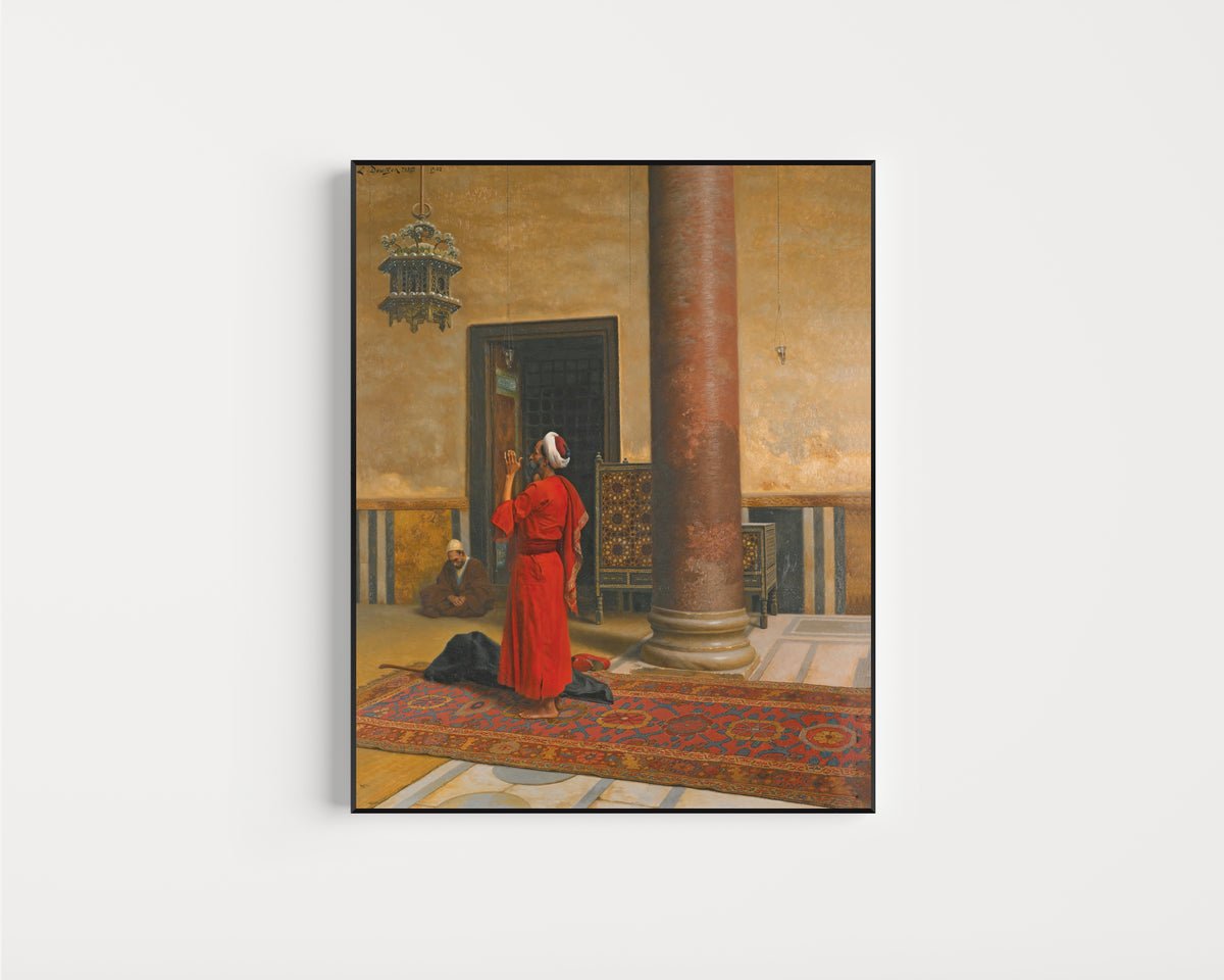 Framed art print of Morning Prayers by Ludwig Deutsch, in a slim black frame on a plain white wall