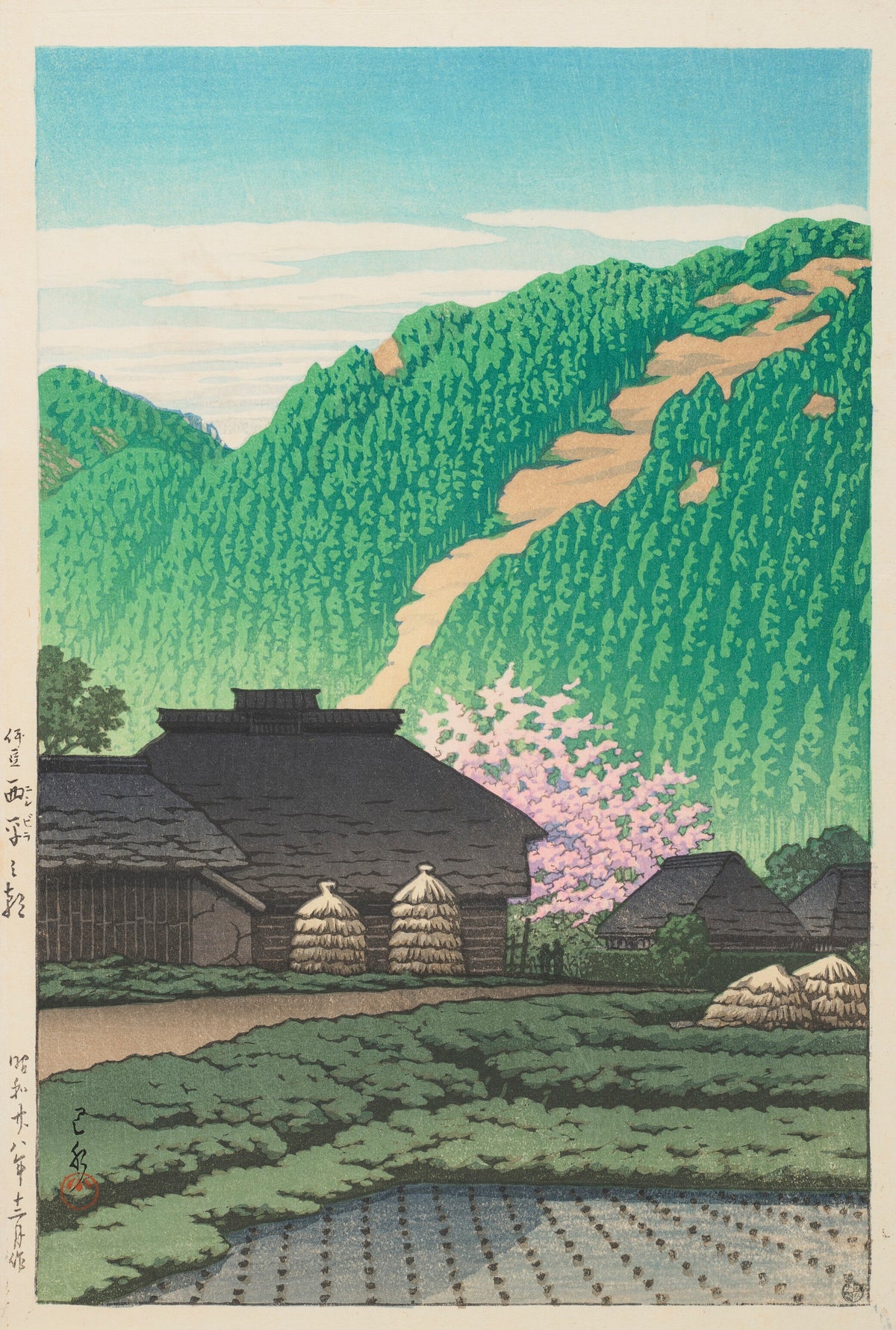 Morning in Nishibira, Izu by Kawase Hasui — A thatched farmhouse under a green hillside and a blossoming cherry