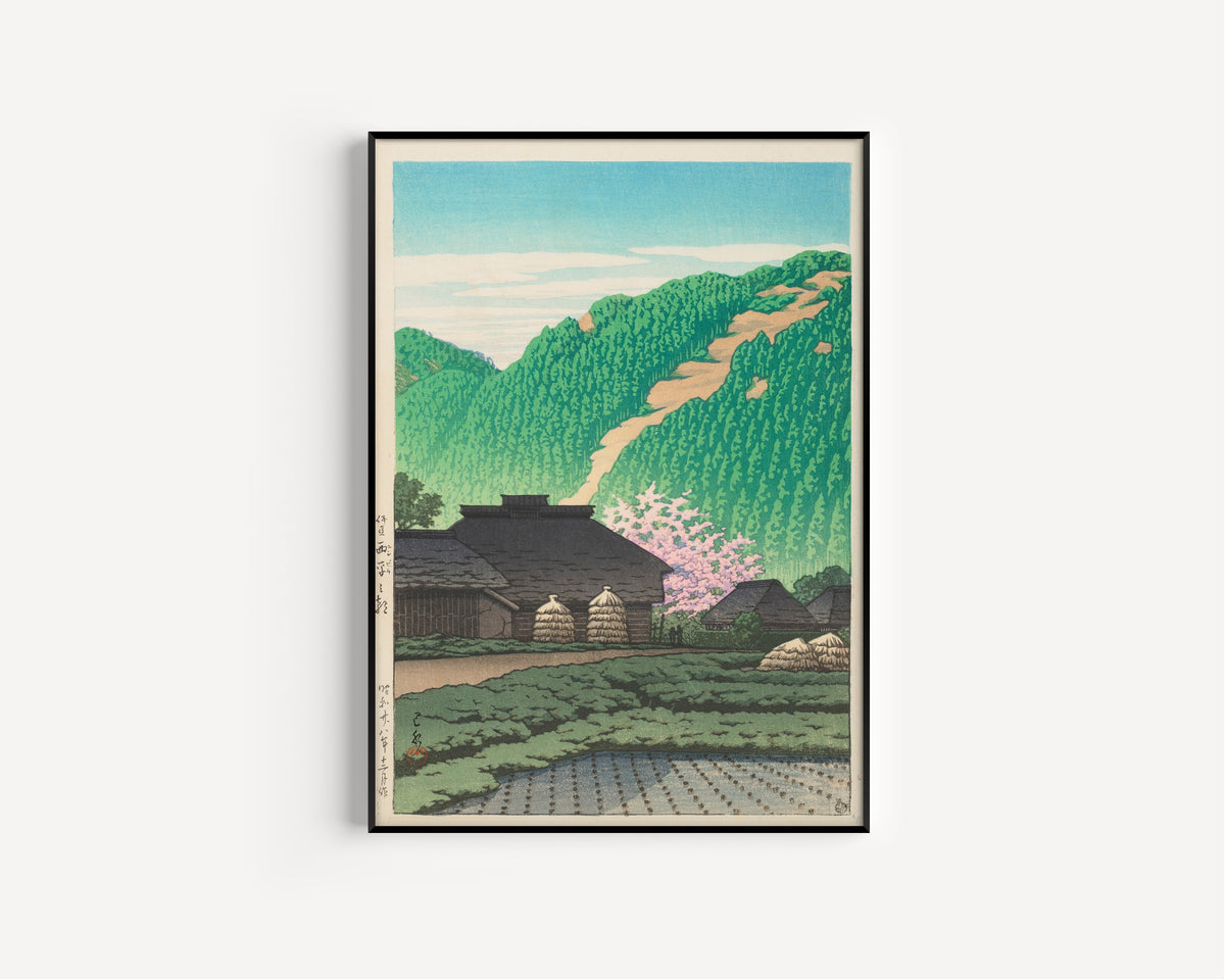 Framed art print of Morning in Nishibira, Izu by Kawase Hasui, in a slim black frame on a plain white wall
