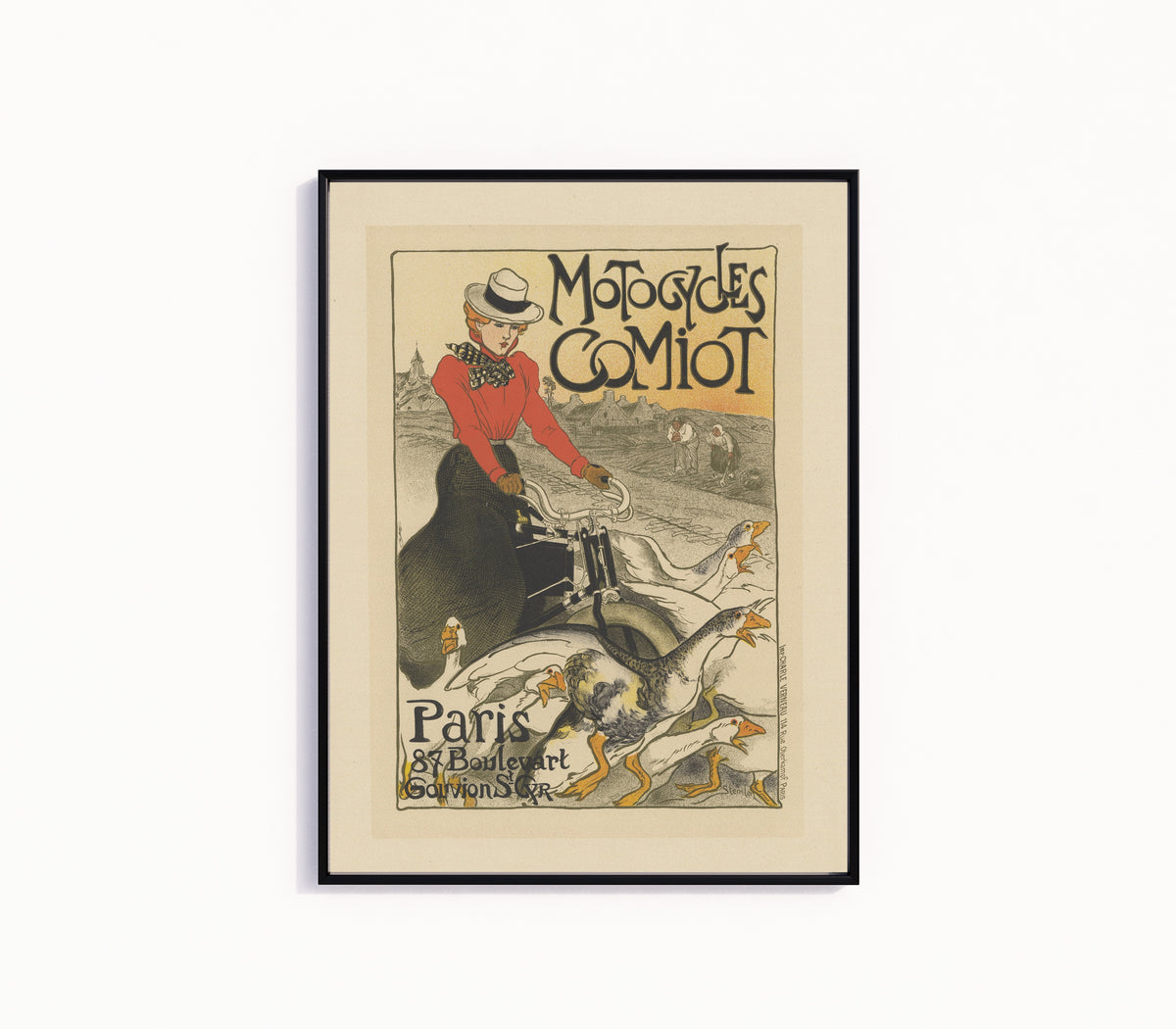 Framed art print of Motocycles Comiot, Paris by Théophile Steinlen, in a slim black frame on a plain white wall