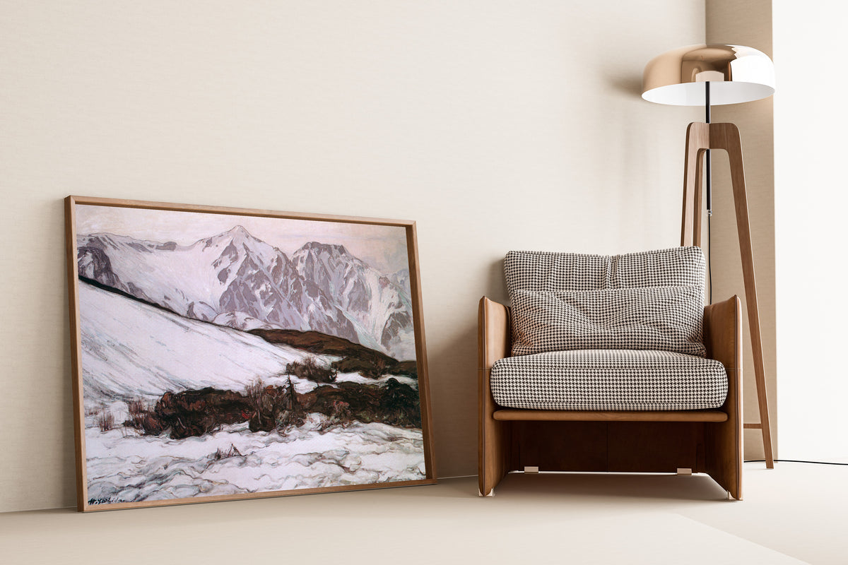 Framed art print of Mount Hakubayari by Hiroshi Yoshida, leaning against a wall beside an armchair and a floor lamp